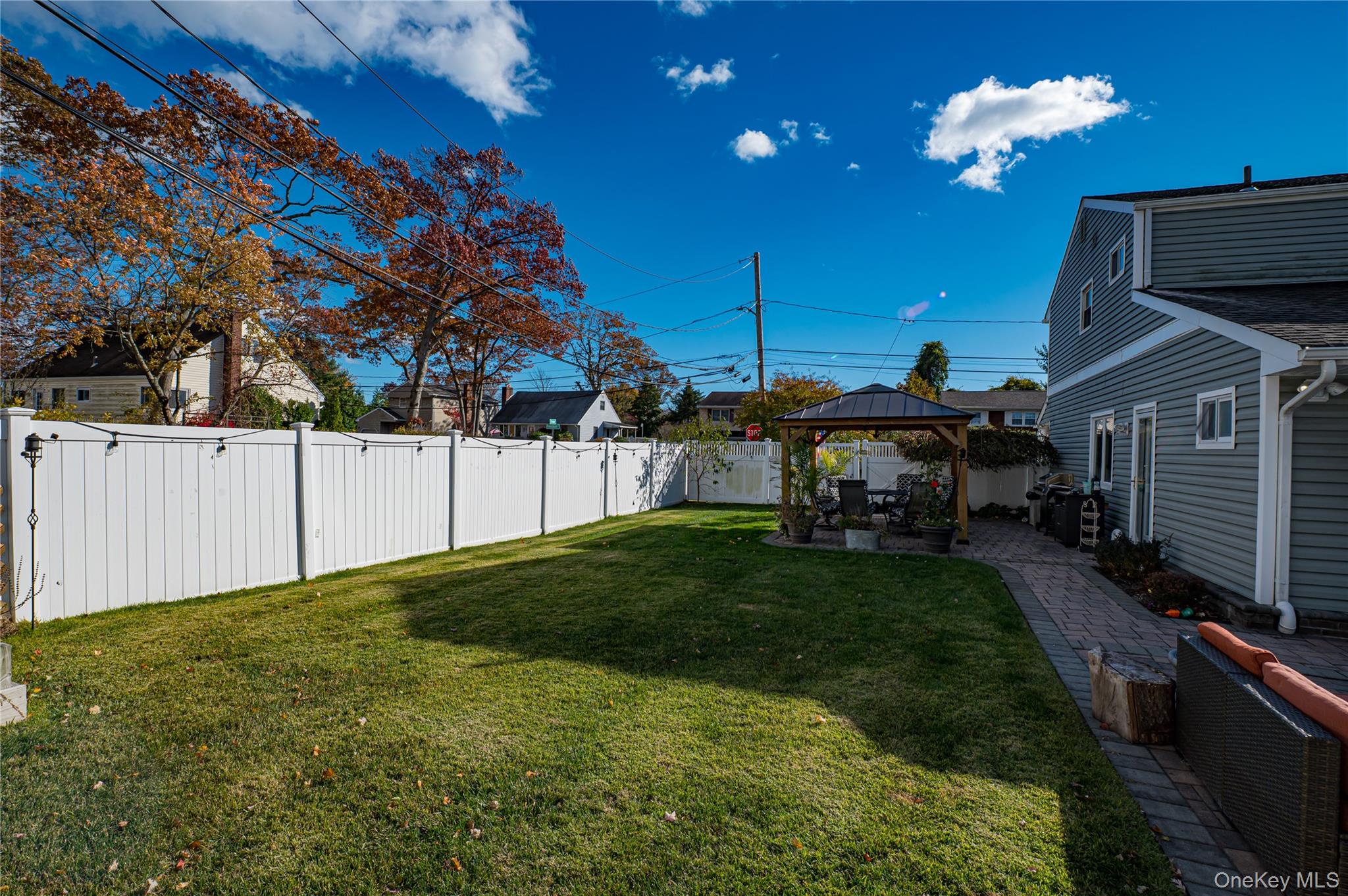 1 Freedom Court Babylon, NY 11702 - Photo 22 of 23 a view of a yard with plants and a barbeque
