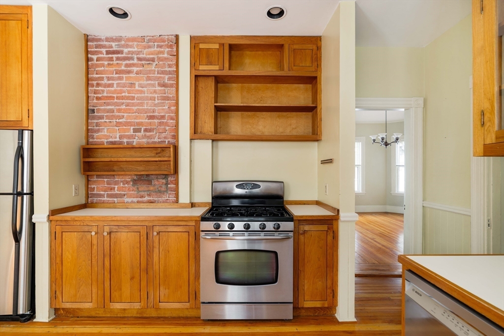 259 Upland Road Cambridge, MA 02138 - Photo 26 of 38 a kitchen with a stove and a cabinet