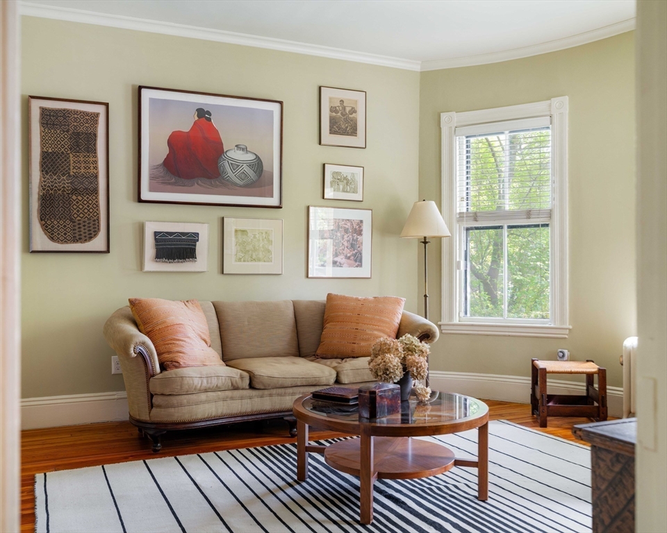259 Upland Road Cambridge, MA 02138 - Photo 5 of 38 a living room with furniture a wooden floor and a window