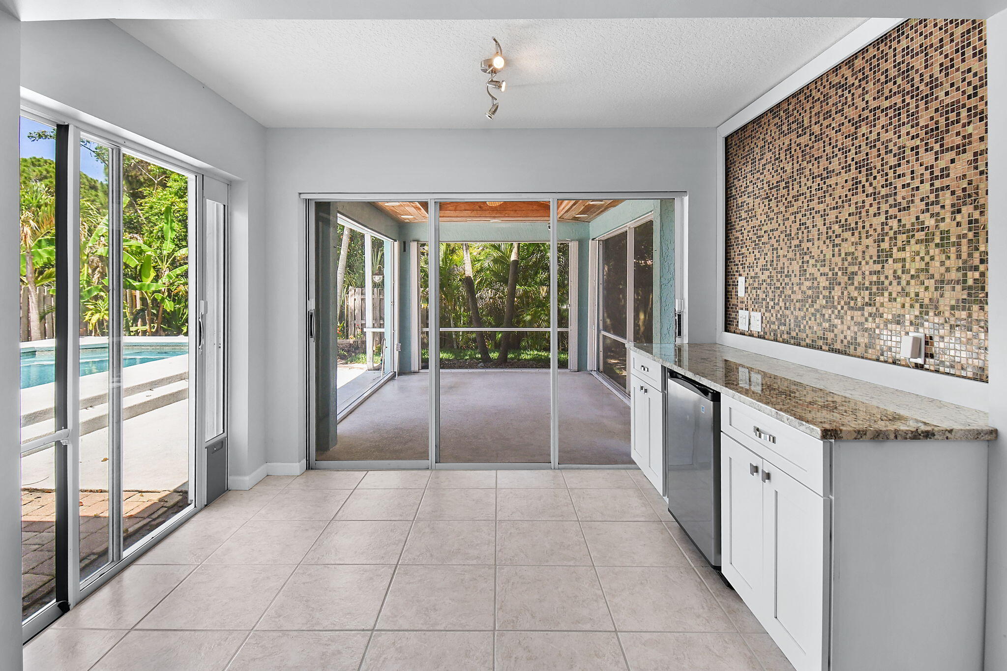 1959 Northwest Marsh Rabbit Lane Jensen Beach, FL 34957 - Photo 14 of 46 View from Family Room to Patio