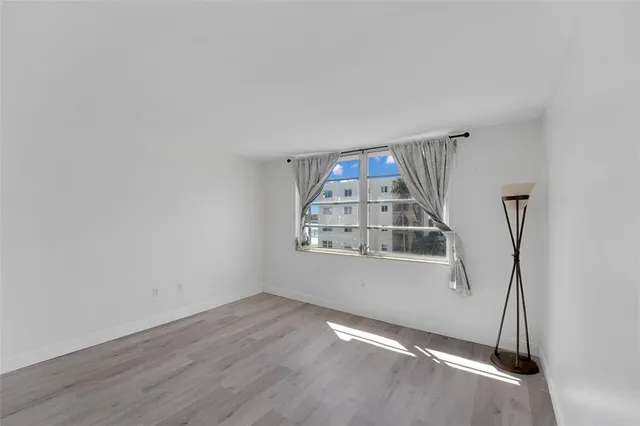 an empty room with a empty space and window