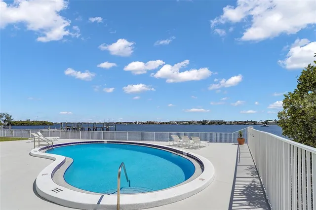 a view of a swimming pool from a balcony