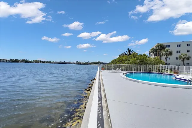 a view of a patio with swimming pool