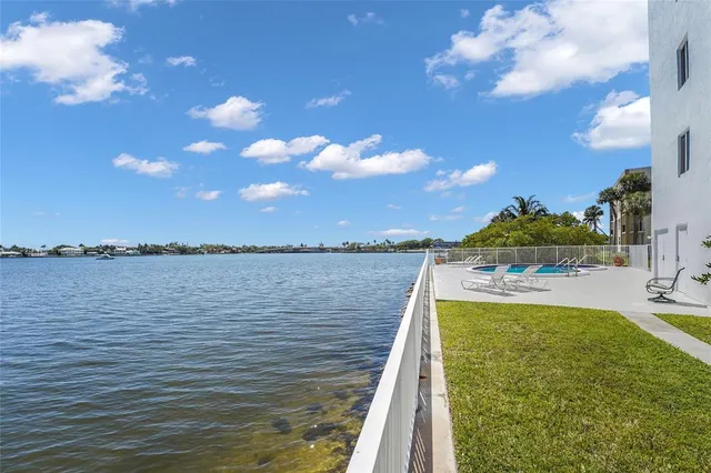 a view of a house with a car parked in front of it