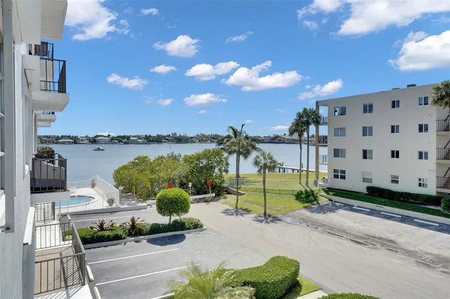 a green field with view of a building