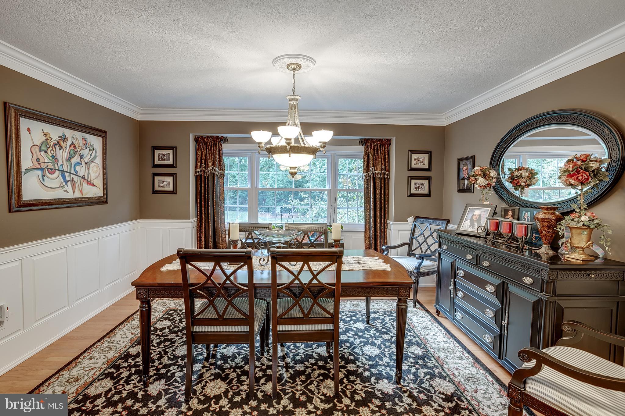 233 Hamilton Road Marlton, NJ 08053 - Photo 12 of 48 a dining room with furniture a large window and a chandelier