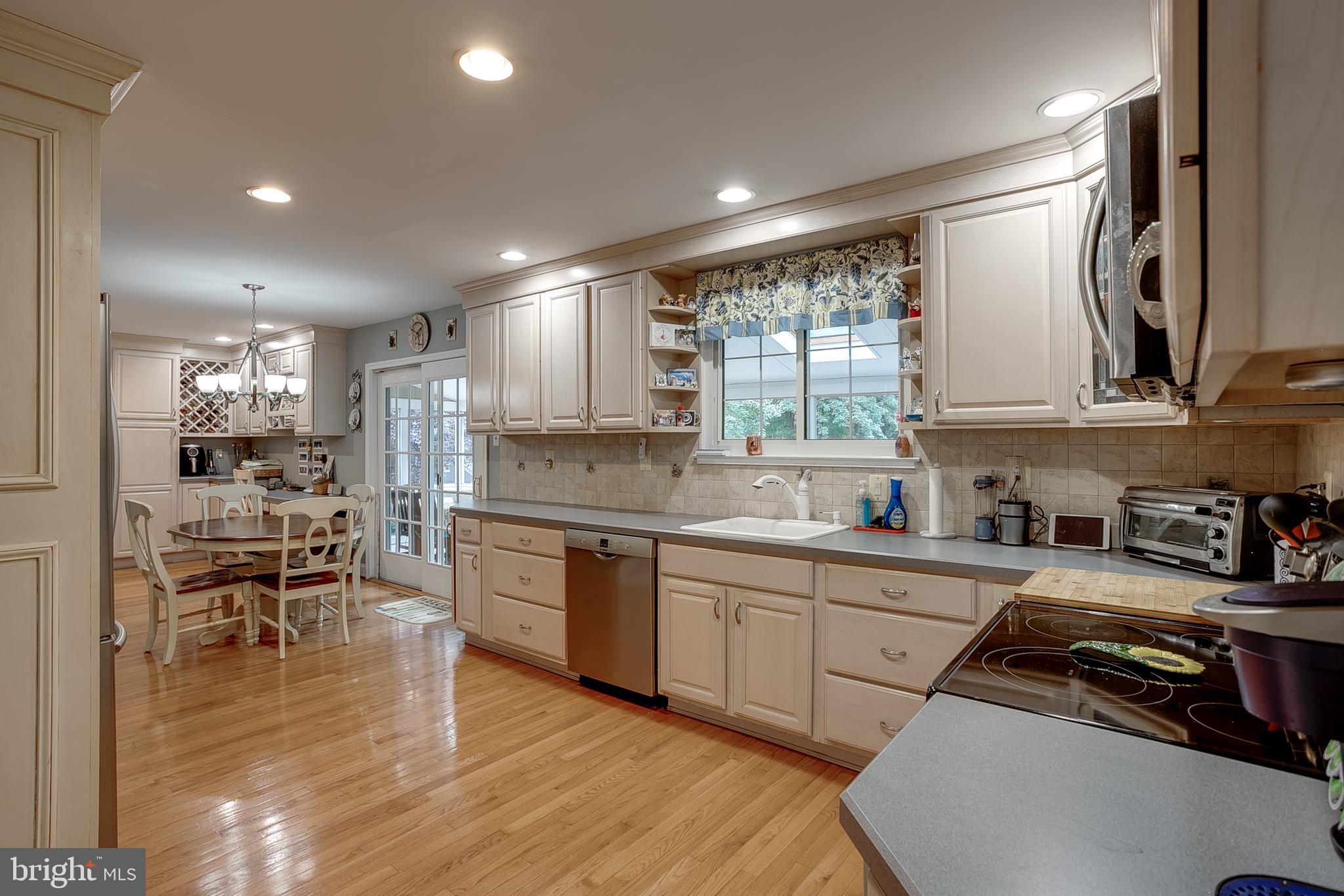 233 Hamilton Road Marlton, NJ 08053 - Photo 19 of 48 a kitchen with stainless steel appliances granite countertop sink stove top oven and cabinets