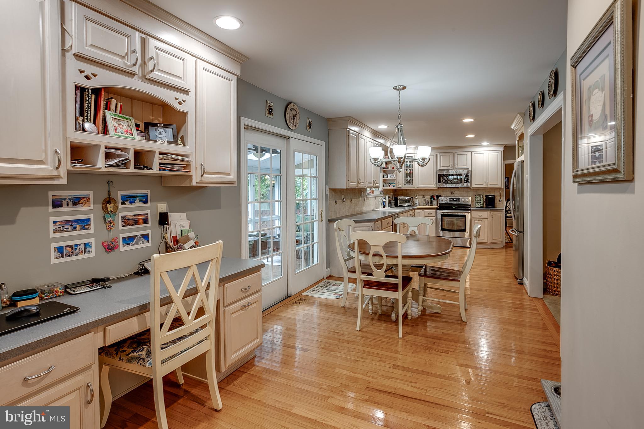 233 Hamilton Road Marlton, NJ 08053 - Photo 22 of 48 a dining room with stainless steel appliances a dining table chairs and kitchen view