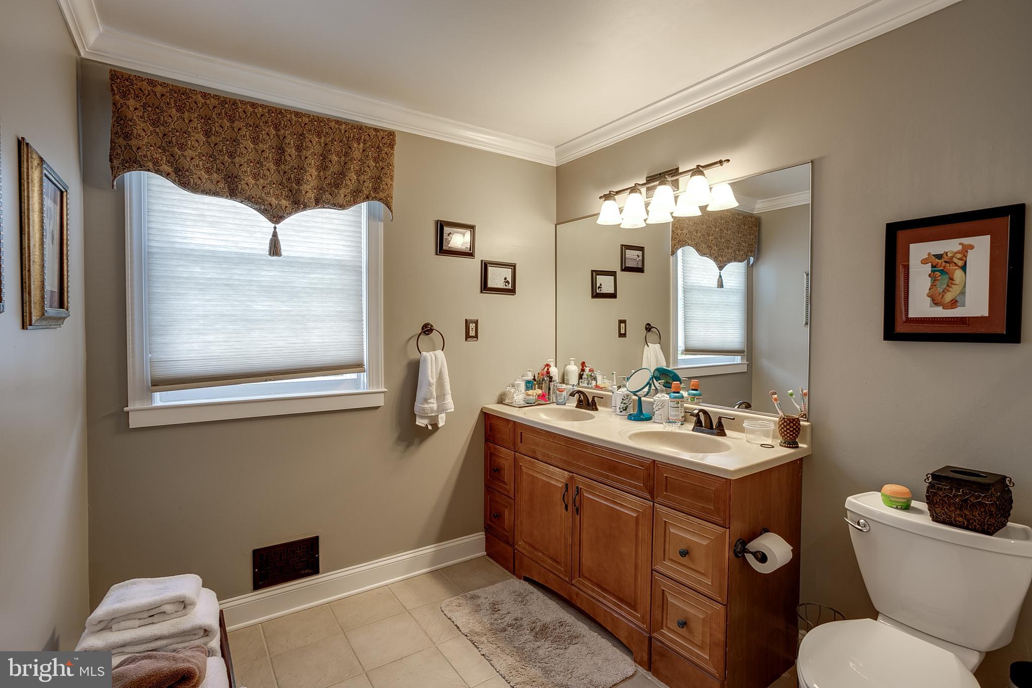 233 Hamilton Road Marlton, NJ 08053 - Photo 30 of 48 a bathroom with a toilet sink and mirror