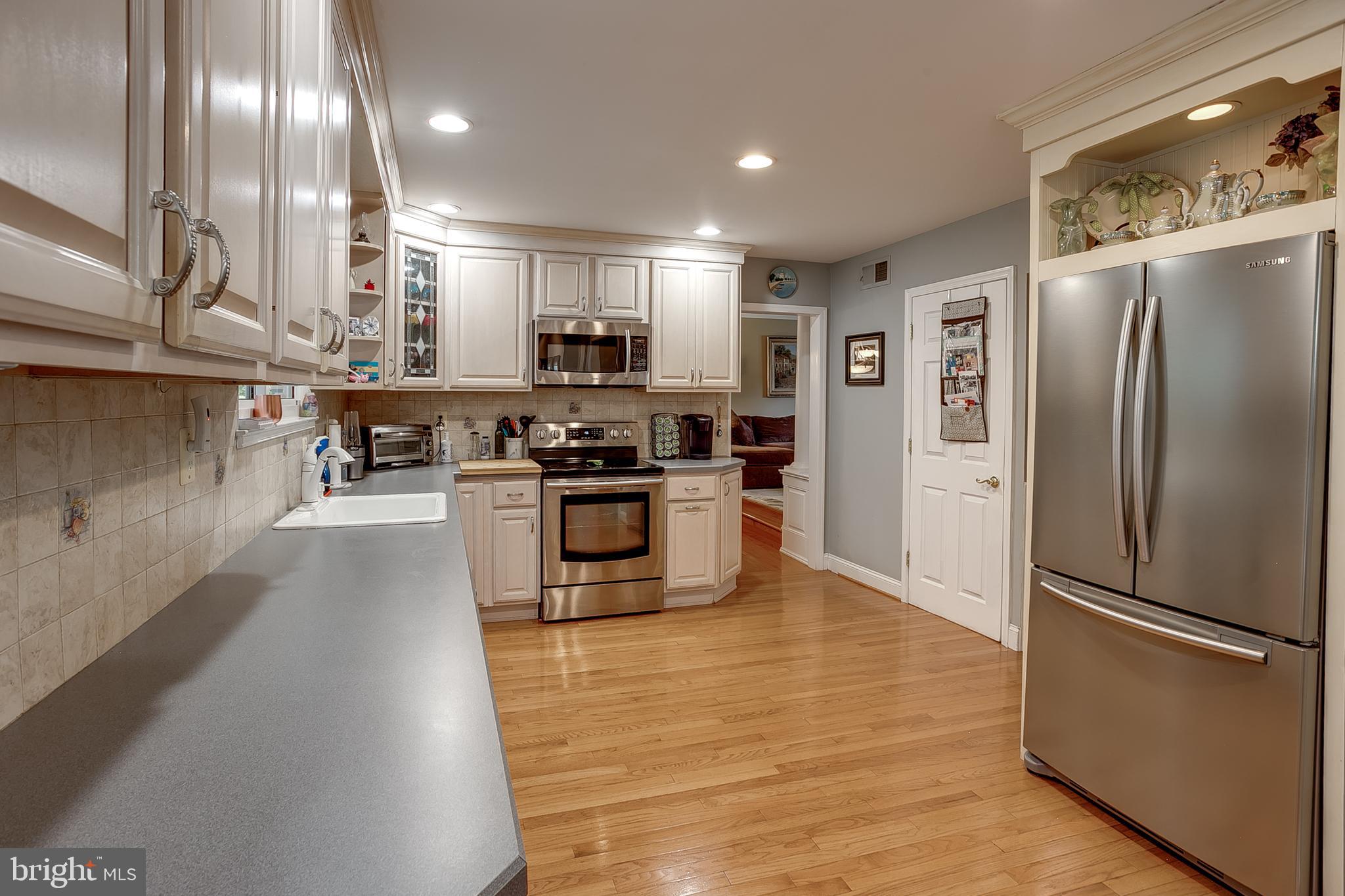 233 Hamilton Road Marlton, NJ 08053 - Photo 33 of 48 a kitchen with stainless steel appliances granite countertop a refrigerator a stove a sink and a refrigerator
