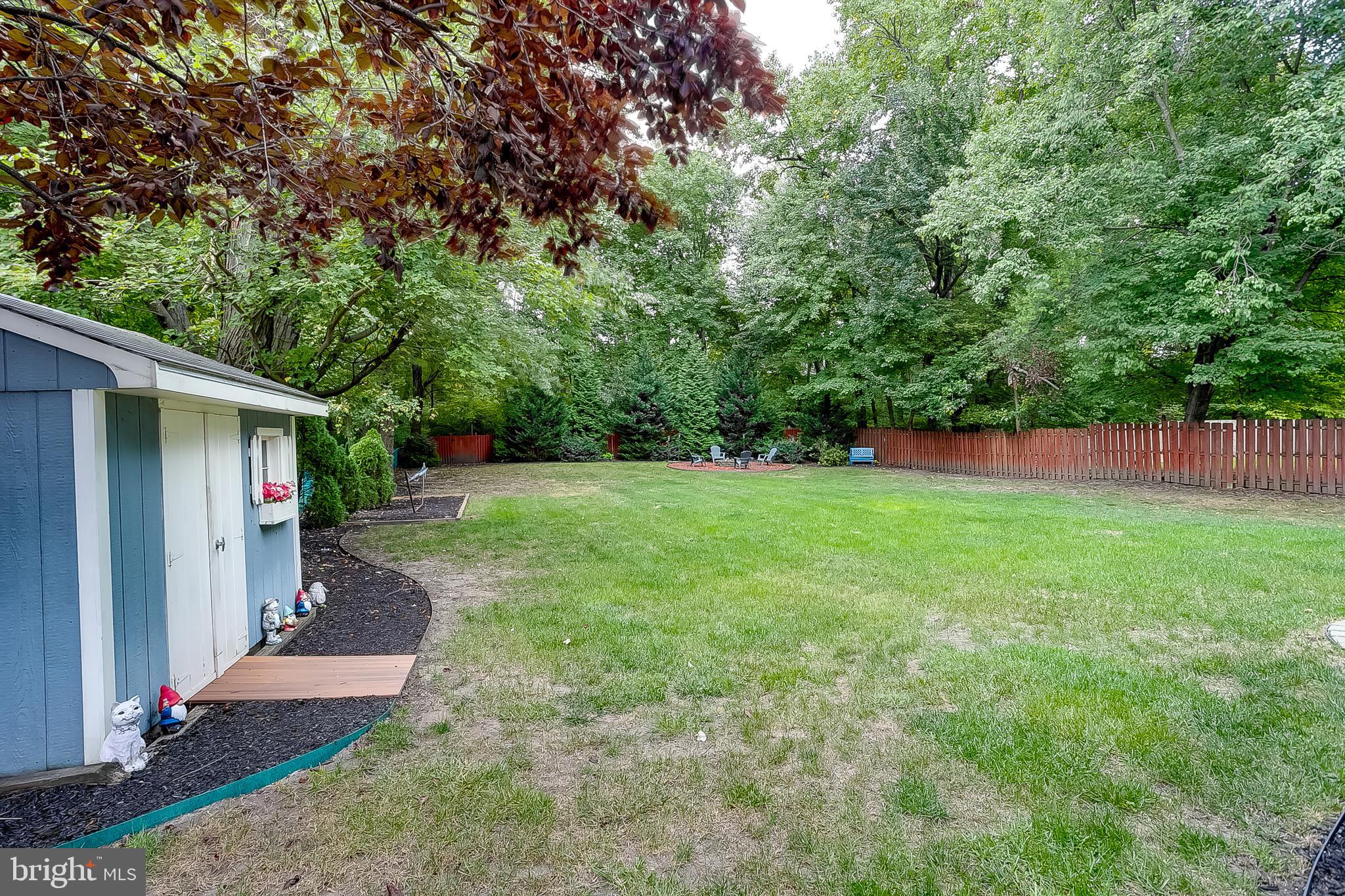 233 Hamilton Road Marlton, NJ 08053 - Photo 5 of 48 a view of a backyard with large trees