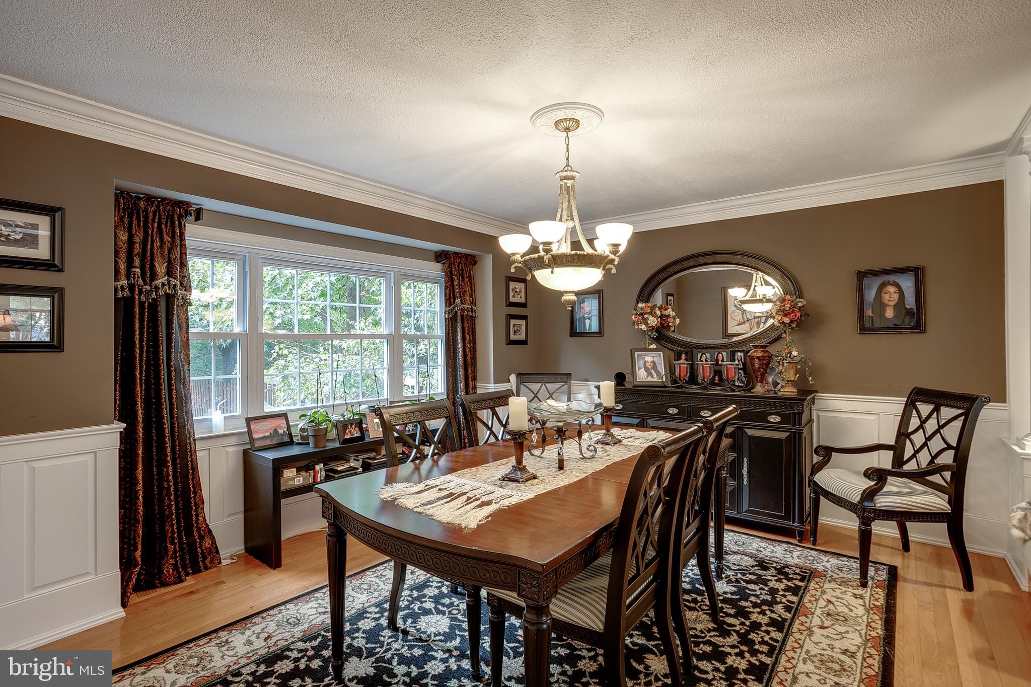 233 Hamilton Road Marlton, NJ 08053 - Photo 10 of 48 a view of a dining room with furniture a chandelier and wooden floor