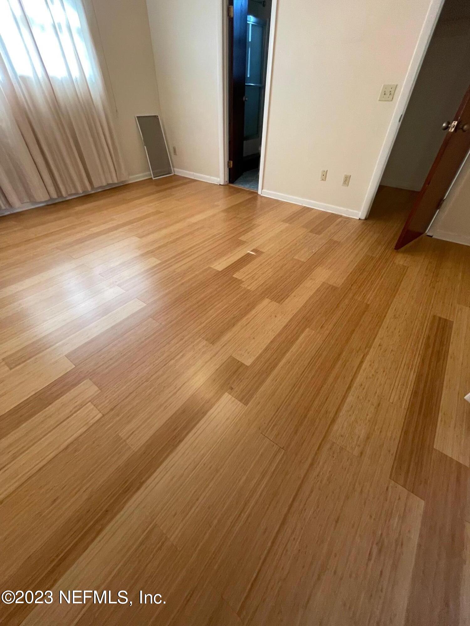 1042 Jamaica Road East Jacksonville, FL 32216 - Photo 14 of 59 a view of empty room with wooden floor