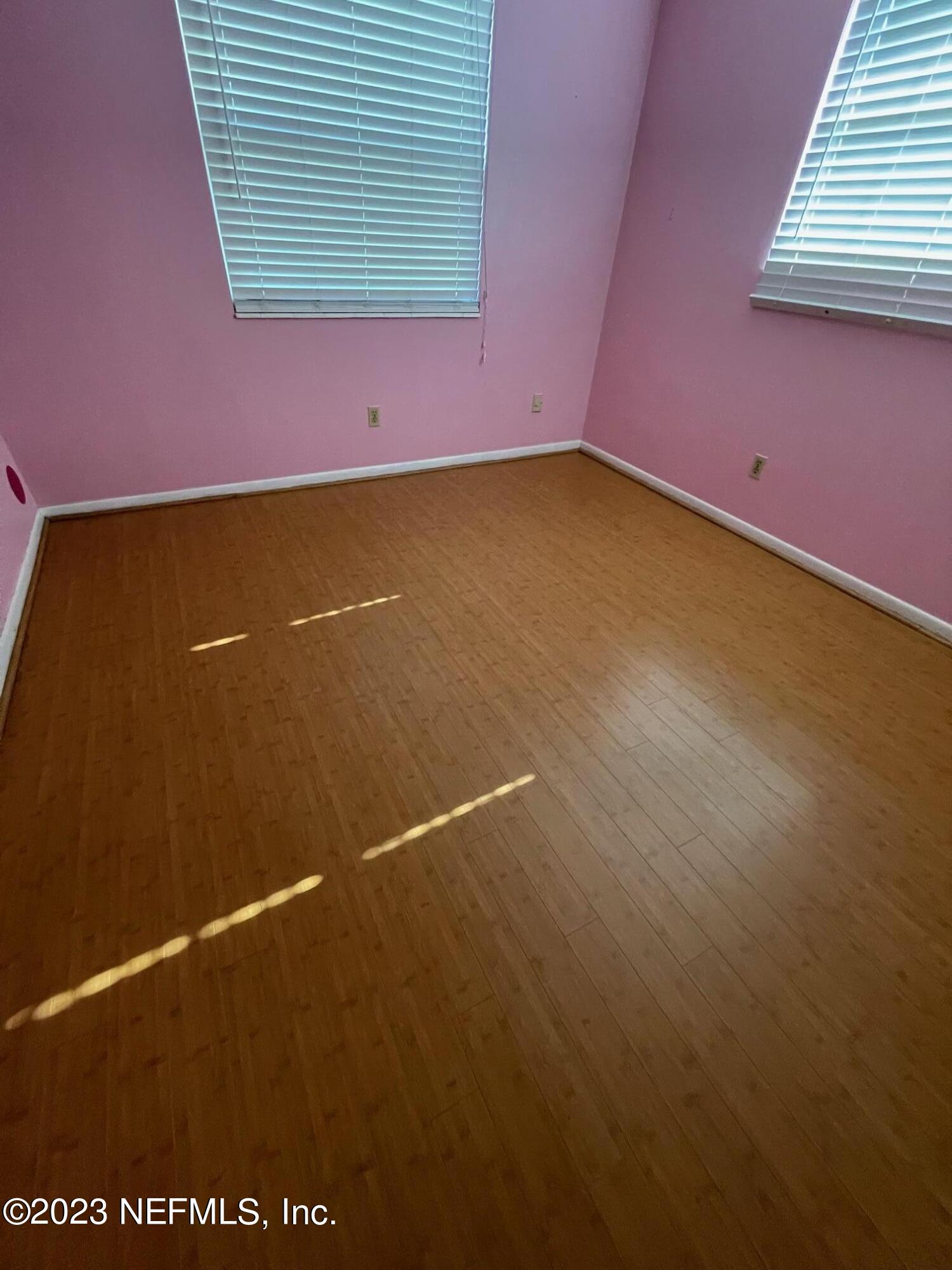 1042 Jamaica Road East Jacksonville, FL 32216 - Photo 17 of 59 an empty room with a window