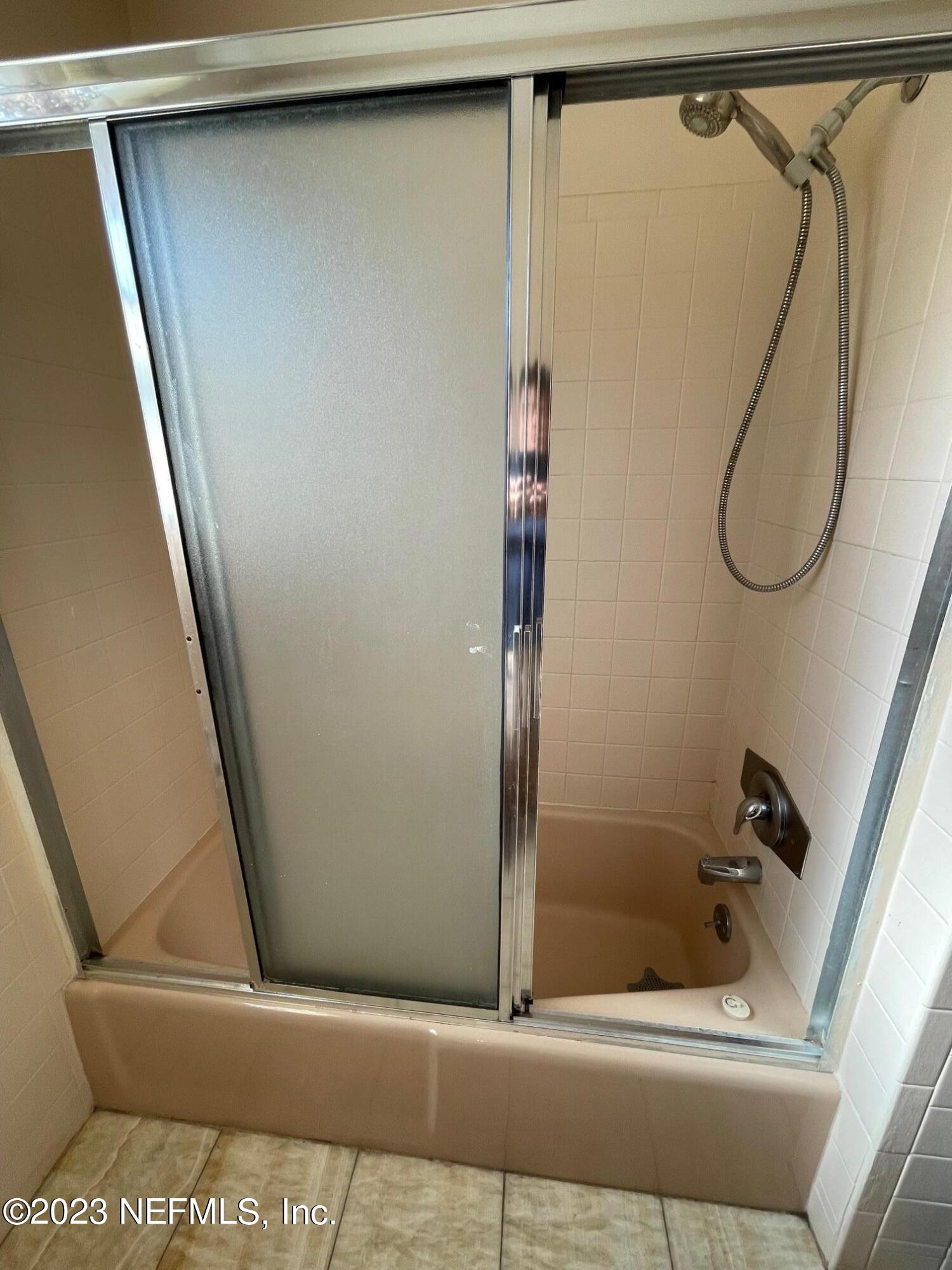 1042 Jamaica Road East Jacksonville, FL 32216 - Photo 23 of 59 a bathroom with a shower