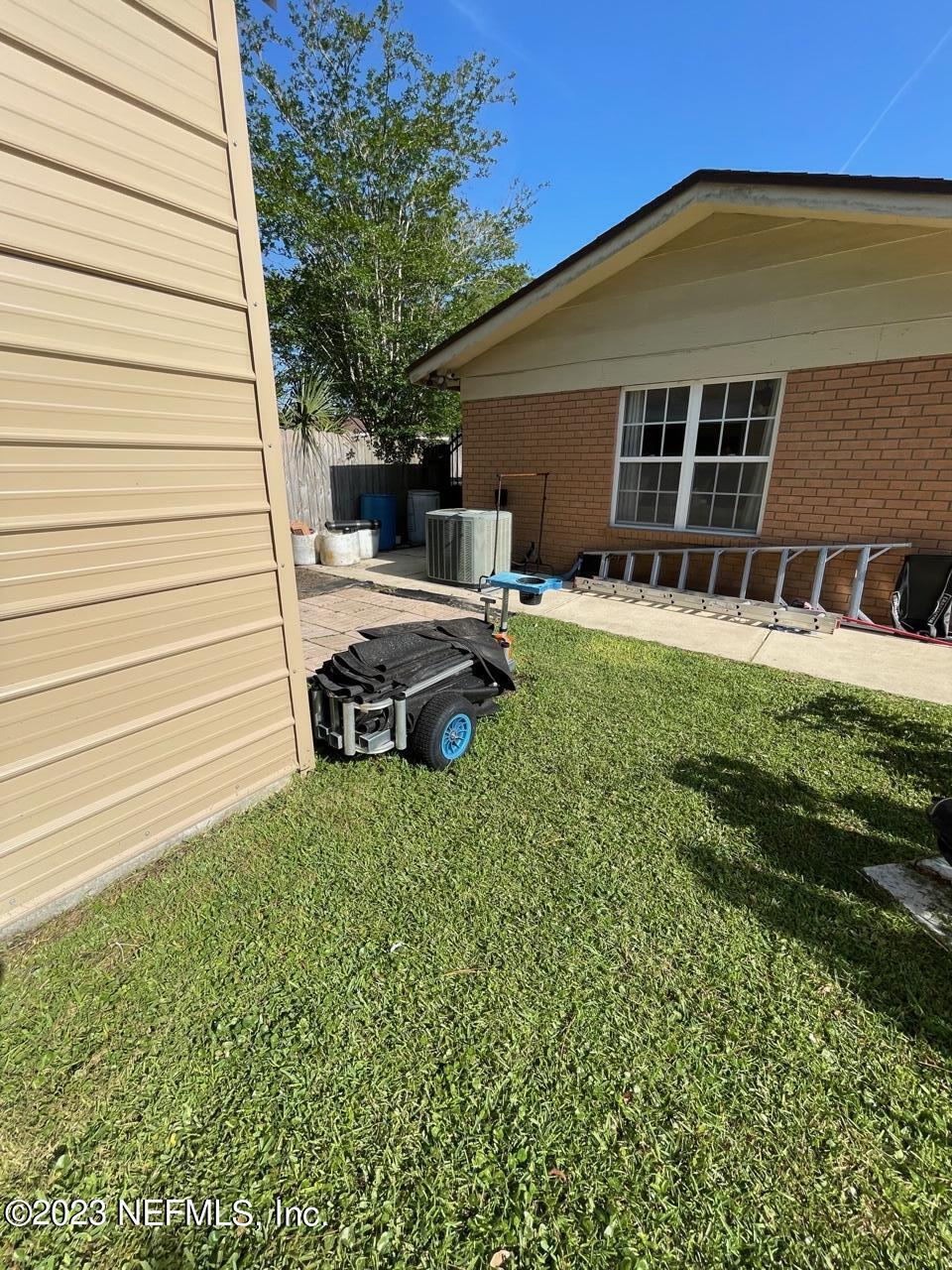1042 Jamaica Road East Jacksonville, FL 32216 - Photo 55 of 59 a front view of a house with a garden