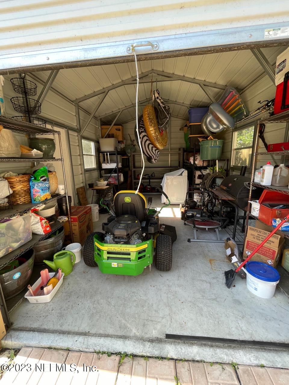 1042 Jamaica Road East Jacksonville, FL 32216 - Photo 58 of 59 a room with lots of different colored cloths