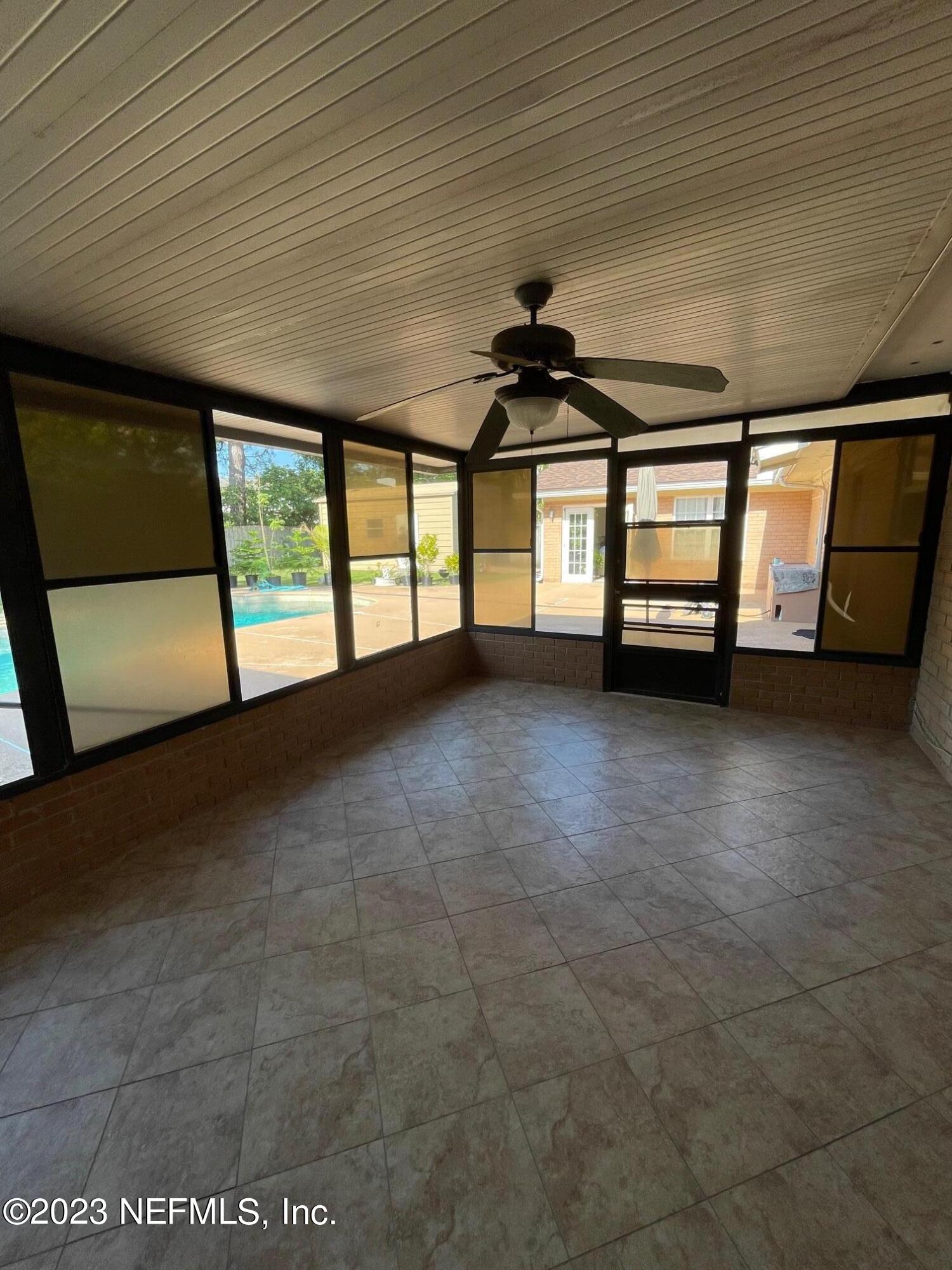 1042 Jamaica Road East Jacksonville, FL 32216 - Photo 8 of 59 a view of an empty room with a window