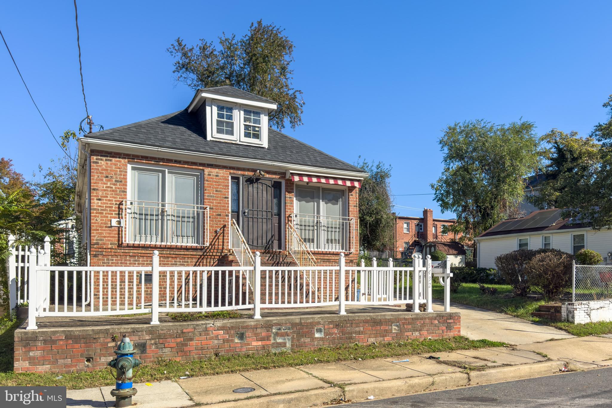 5432 Call Place Southeast Washington, DC 20019 - Photo 2 of 6 a front view of a house with a garden