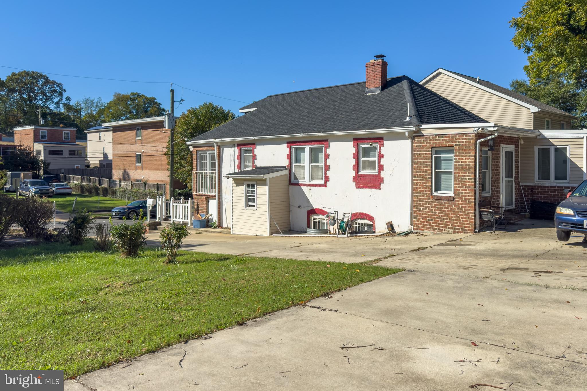 5432 Call Place Southeast Washington, DC 20019 - Photo 5 of 6 a front view of a house with a yard and garage