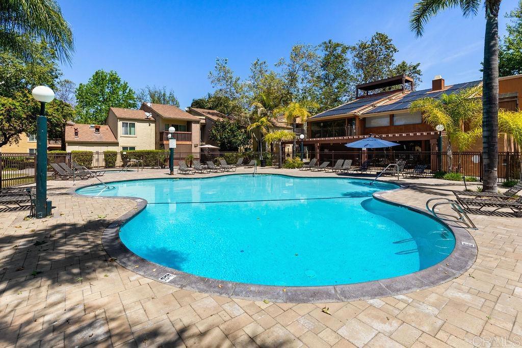 5918 Rancho Mission Road, Unit 62 San Diego, CA 92108 - Photo 30 of 37 a view of a swimming pool with outdoor seating