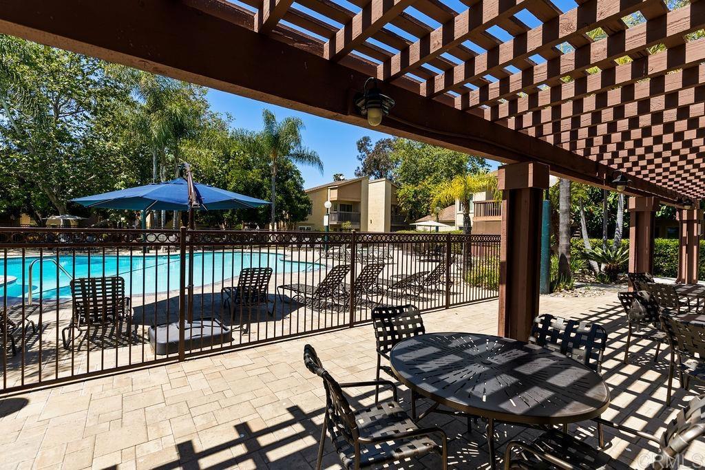 5918 Rancho Mission Road, Unit 62 San Diego, CA 92108 - Photo 33 of 37 a view of a chairs and table in the patio