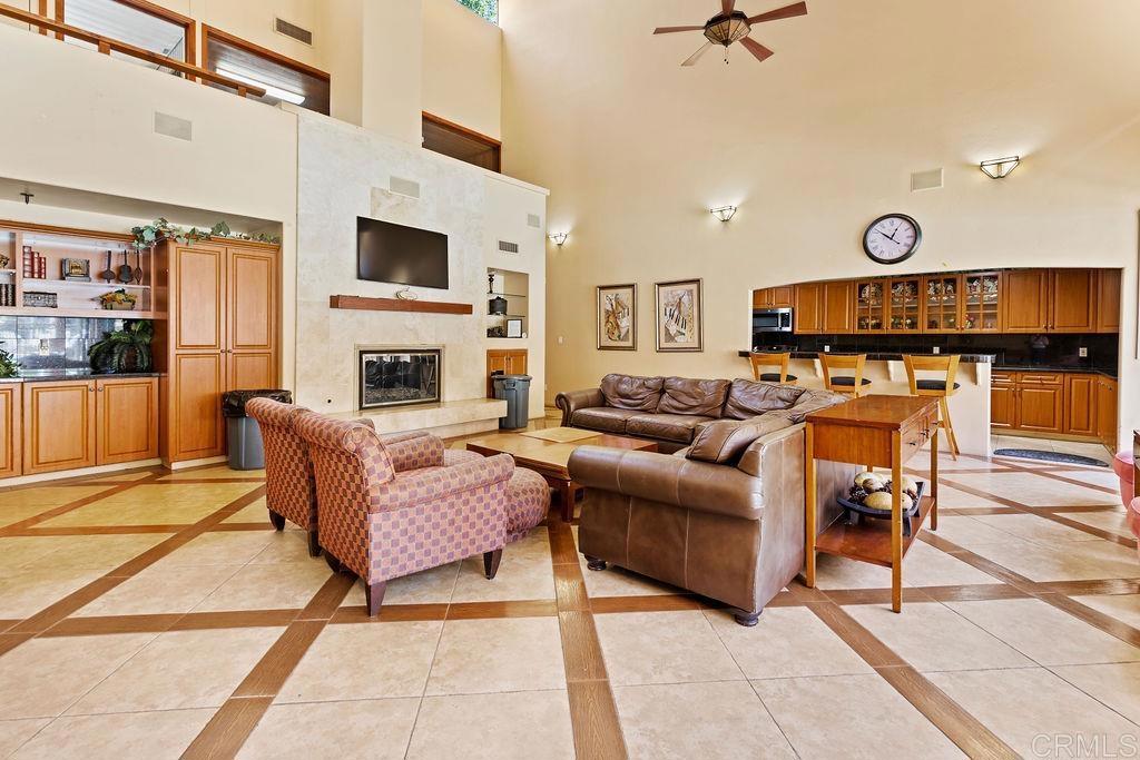 5918 Rancho Mission Road, Unit 62 San Diego, CA 92108 - Photo 35 of 37 a living room with furniture and a fireplace