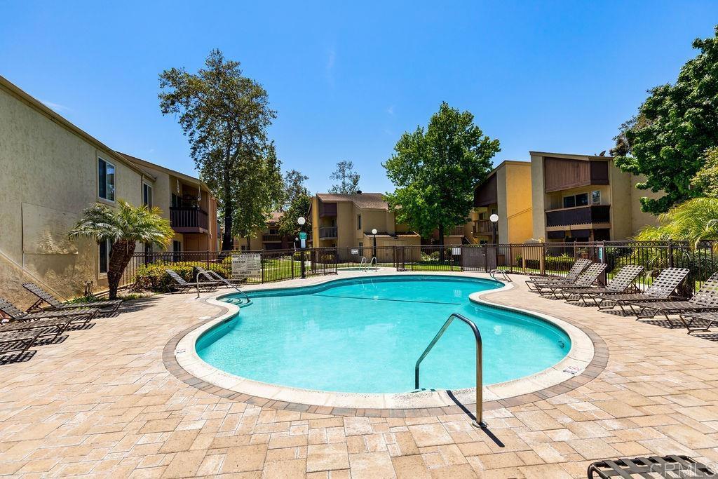 5918 Rancho Mission Road, Unit 62 San Diego, CA 92108 - Photo 36 of 37 a view of swimming pool with outdoor seating