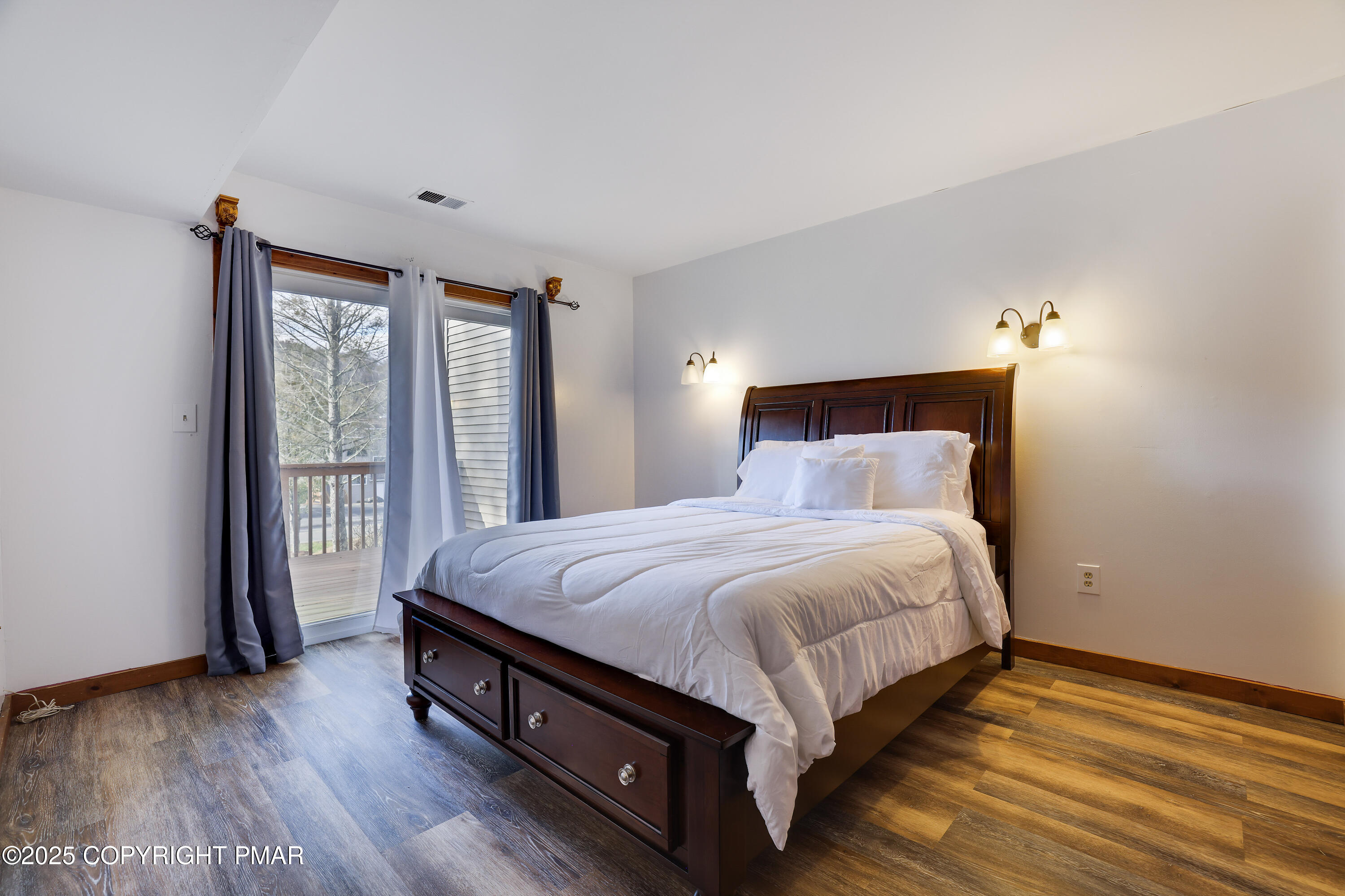 3336 Windemere Drive Bushkill, PA 18324 - Photo 11 of 67 a large bed sitting in a bedroom next to a window