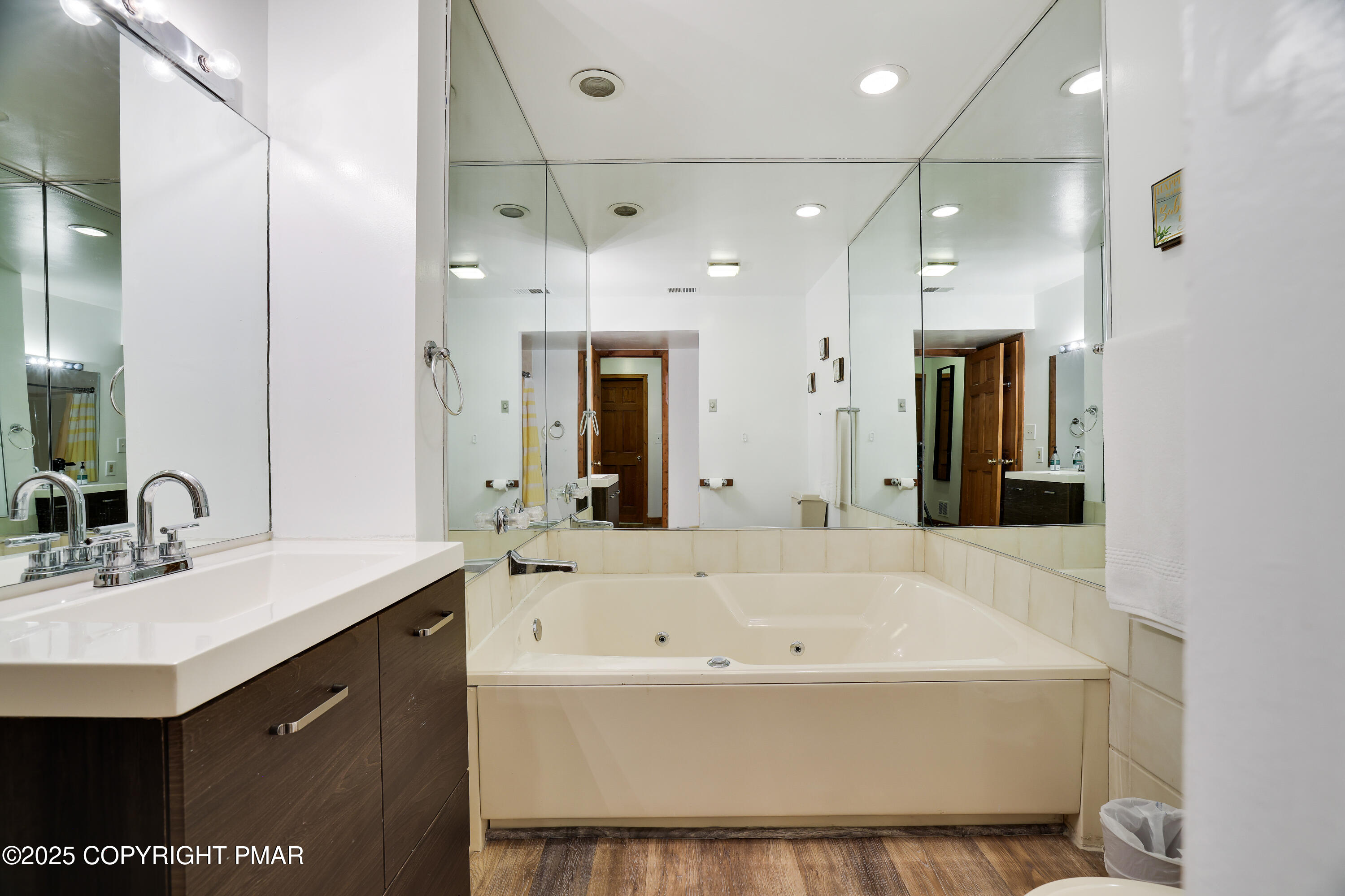 3336 Windemere Drive Bushkill, PA 18324 - Photo 13 of 67 a bathroom with a bathtub a sink a mirror and a shower