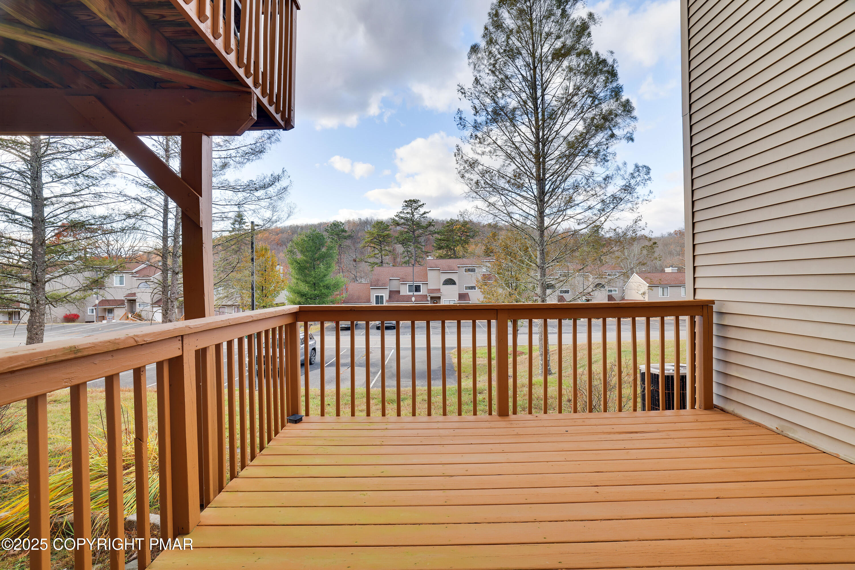 3336 Windemere Drive Bushkill, PA 18324 - Photo 14 of 67 a view of balcony with wooden floor and fence and floor
