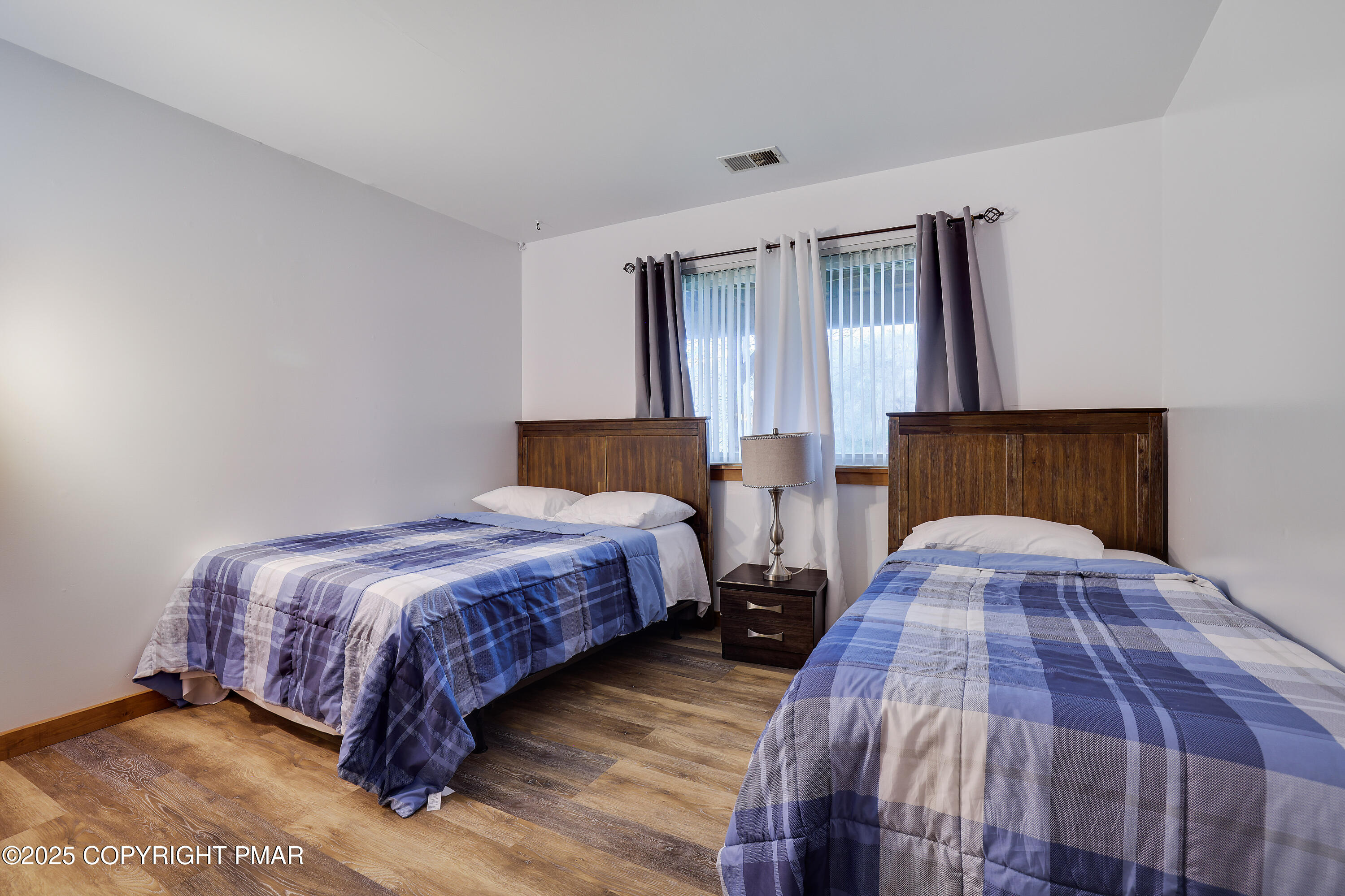 3336 Windemere Drive Bushkill, PA 18324 - Photo 15 of 67 a bedroom with bed and wooden floor