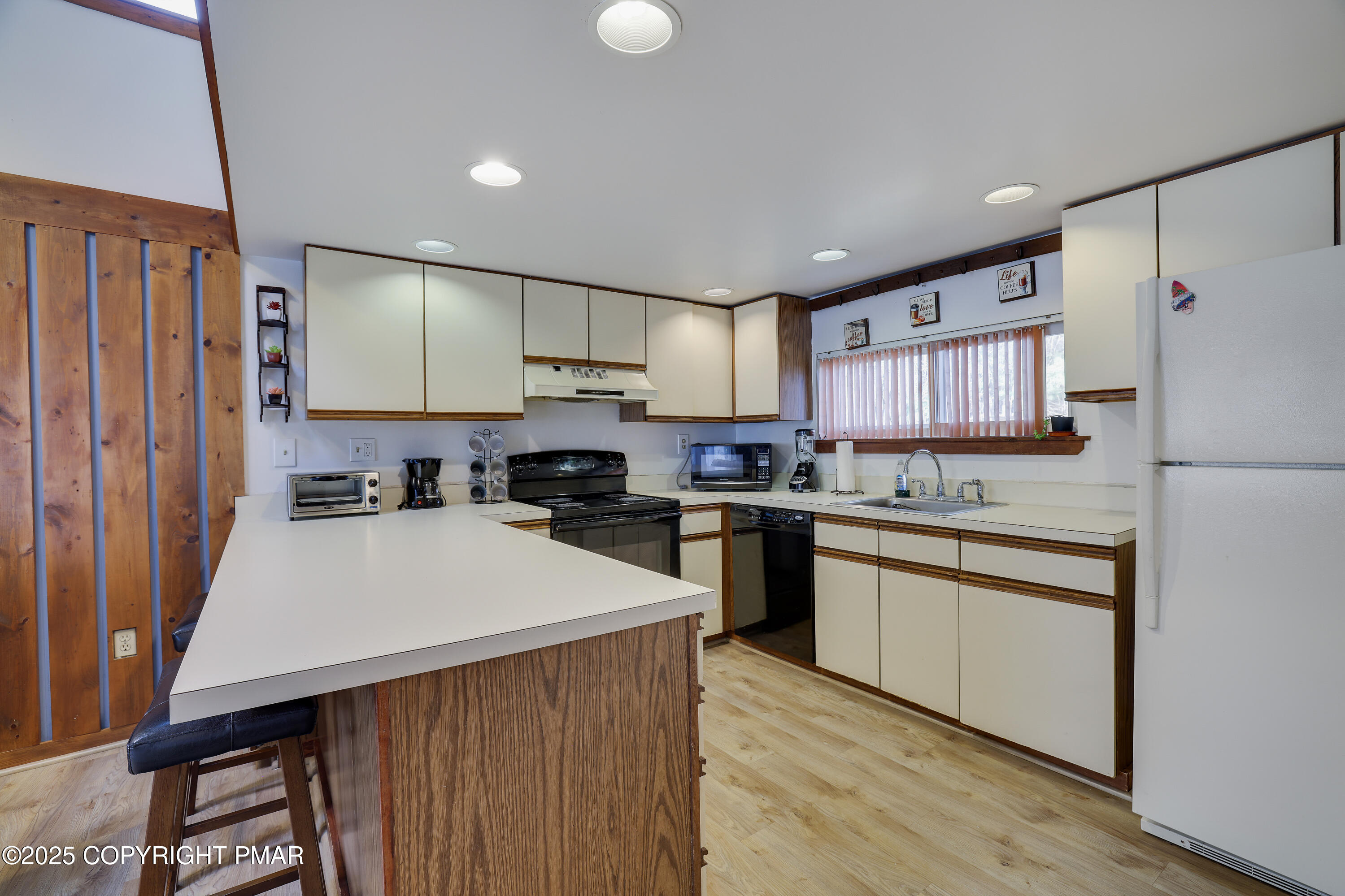 3336 Windemere Drive Bushkill, PA 18324 - Photo 22 of 67 a kitchen with stainless steel appliances a refrigerator sink and microwave