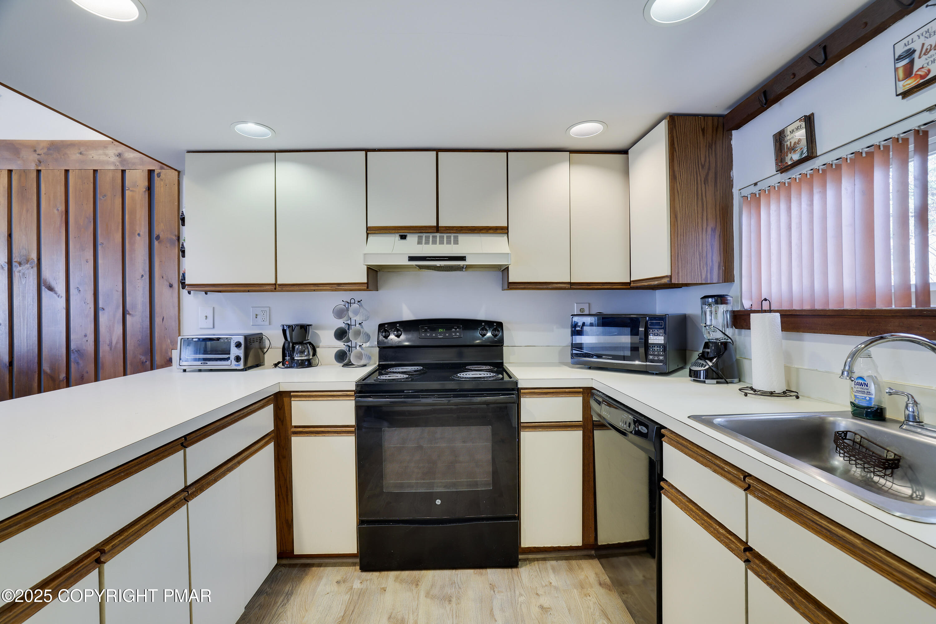 3336 Windemere Drive Bushkill, PA 18324 - Photo 24 of 67 a kitchen with a sink stove and cabinets