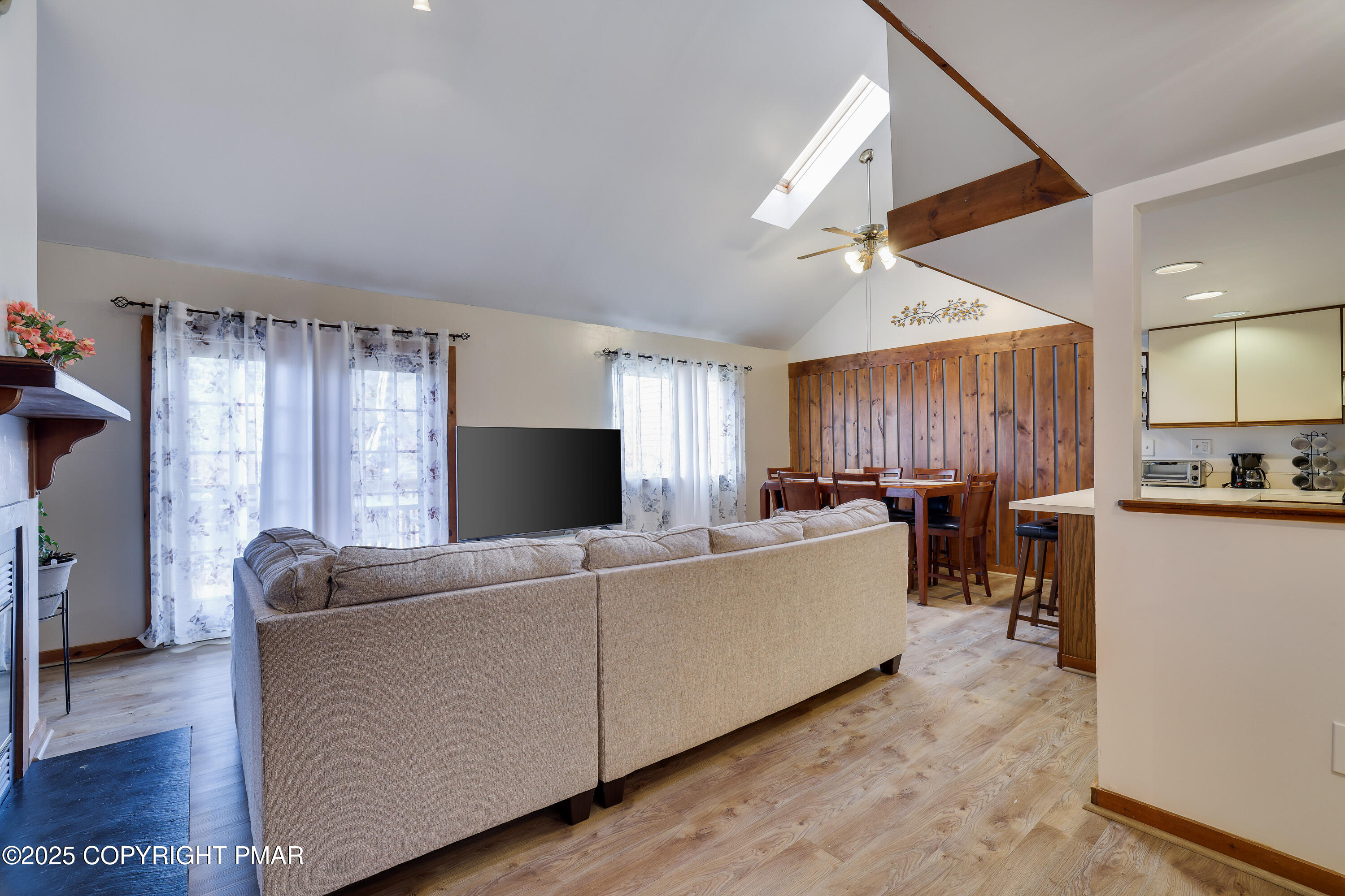 3336 Windemere Drive Bushkill, PA 18324 - Photo 4 of 67 a living room with furniture a dining table and a large window