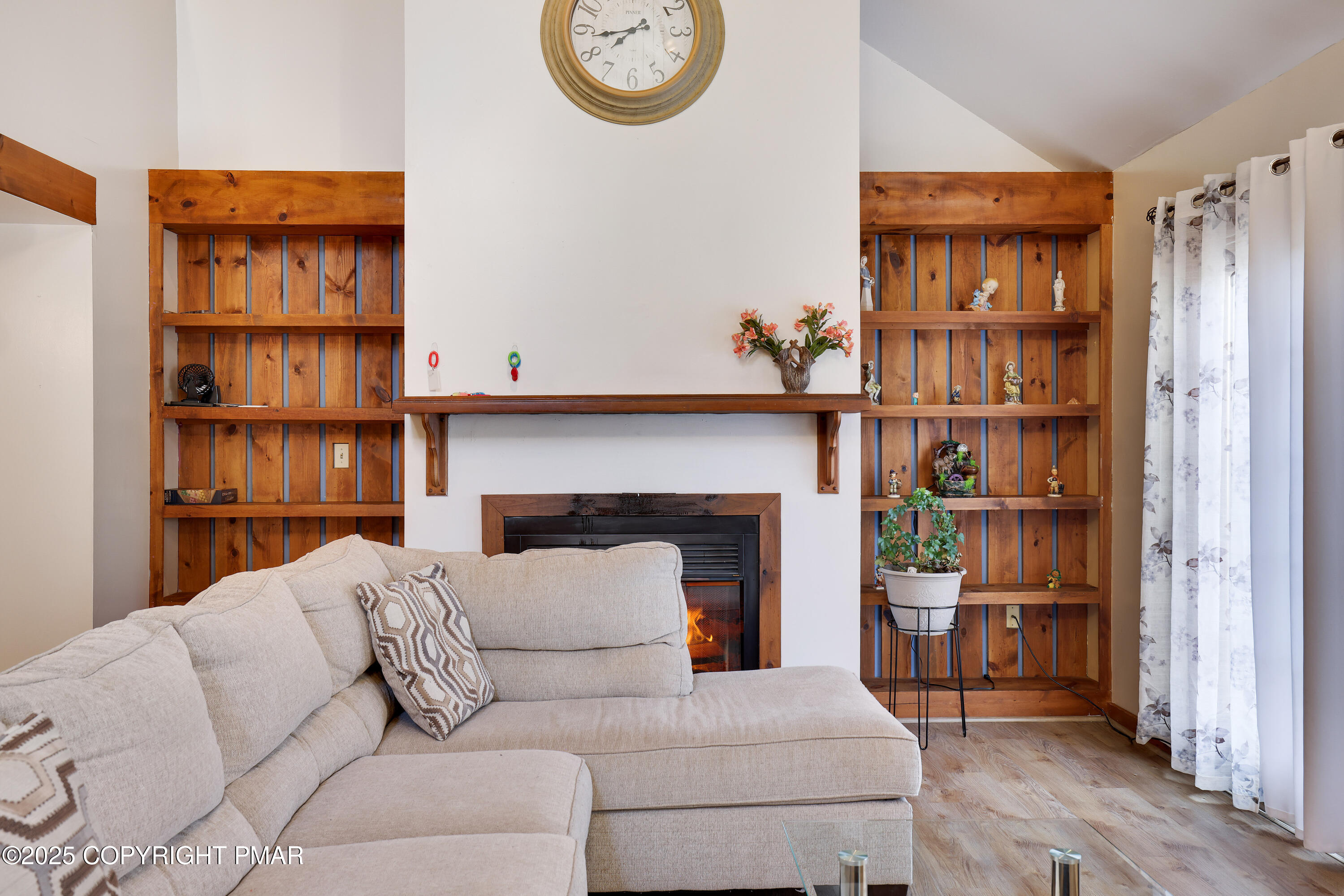 3336 Windemere Drive Bushkill, PA 18324 - Photo 7 of 67 a living room with furniture and a fireplace