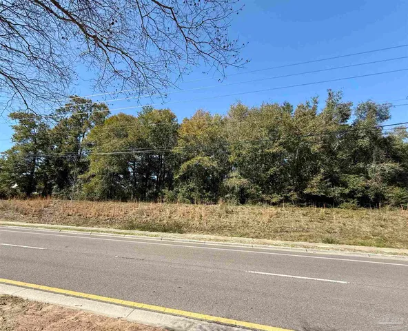 a view of a yard and a mountain