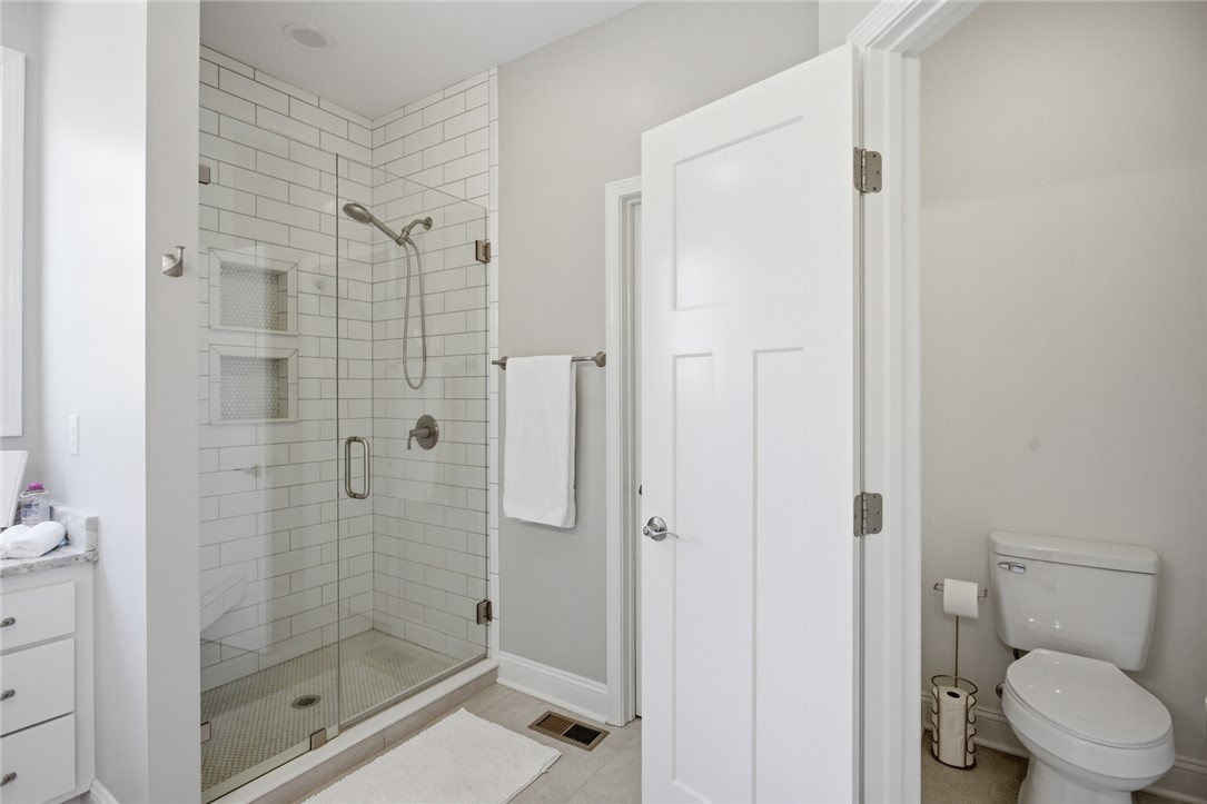 105 Winterbrook Circle Seneca, SC 29678 - Photo 24 of 48 This bathroom features a sleek glass-enclosed walk in shower and modern fixtures, perfect for daily rejuvenation.