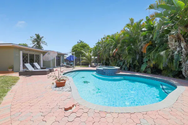 a view of a swimming pool with a patio