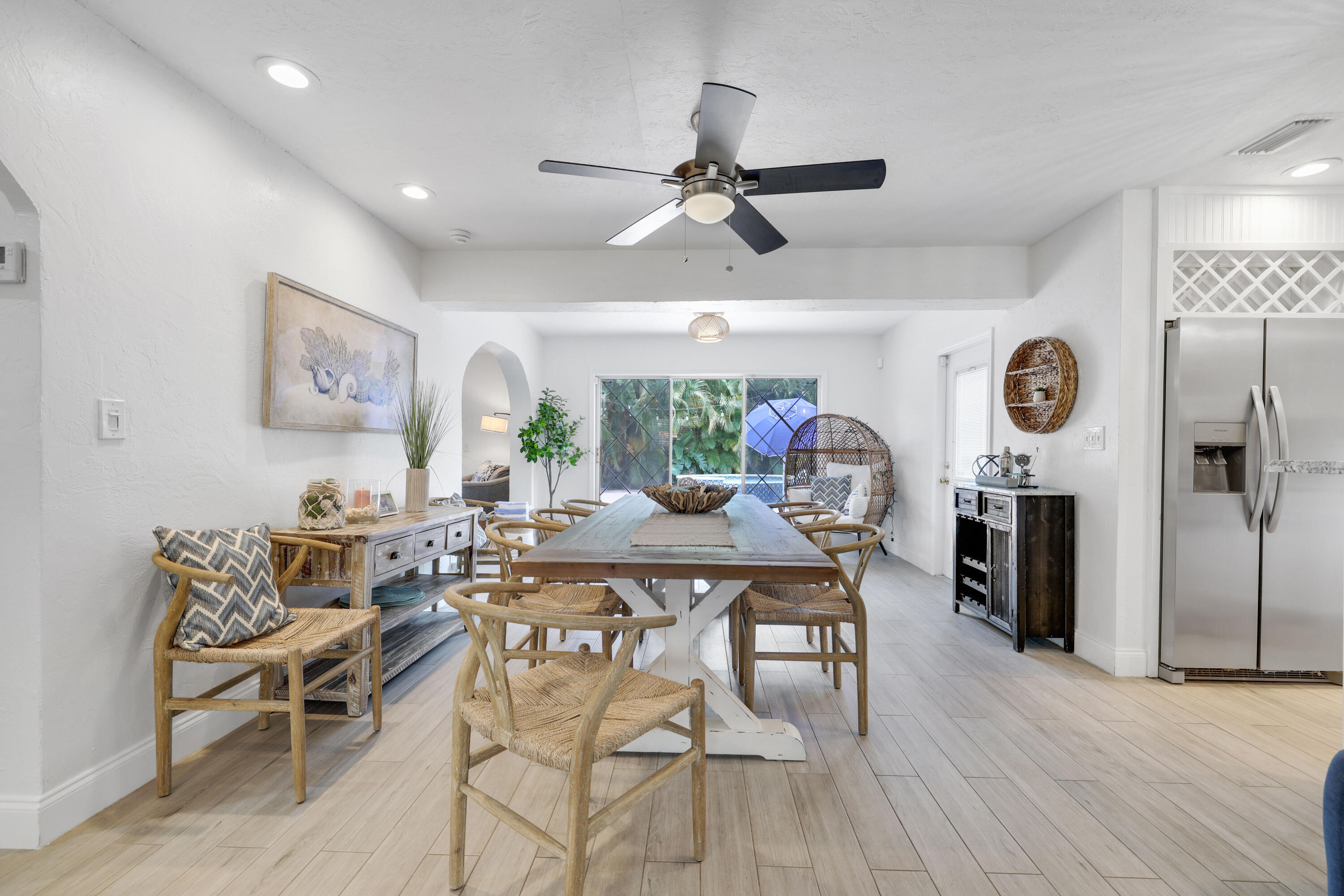 342 Southwest 14th Street Pompano Beach, FL 33060 - Photo 11 of 39 a view of a dining room with furniture and a chandelier