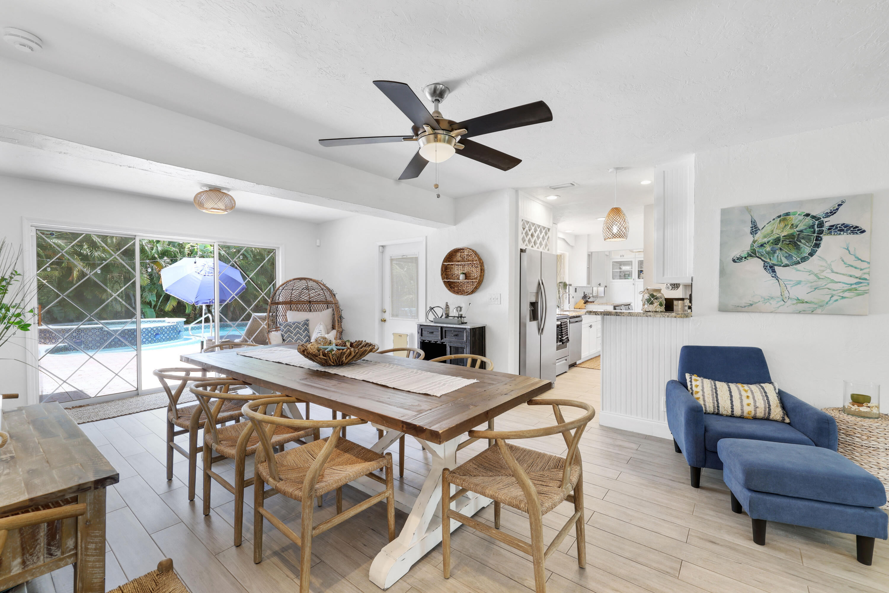 342 Southwest 14th Street Pompano Beach, FL 33060 - Photo 16 of 39 a view of a dining room with furniture and wooden floor