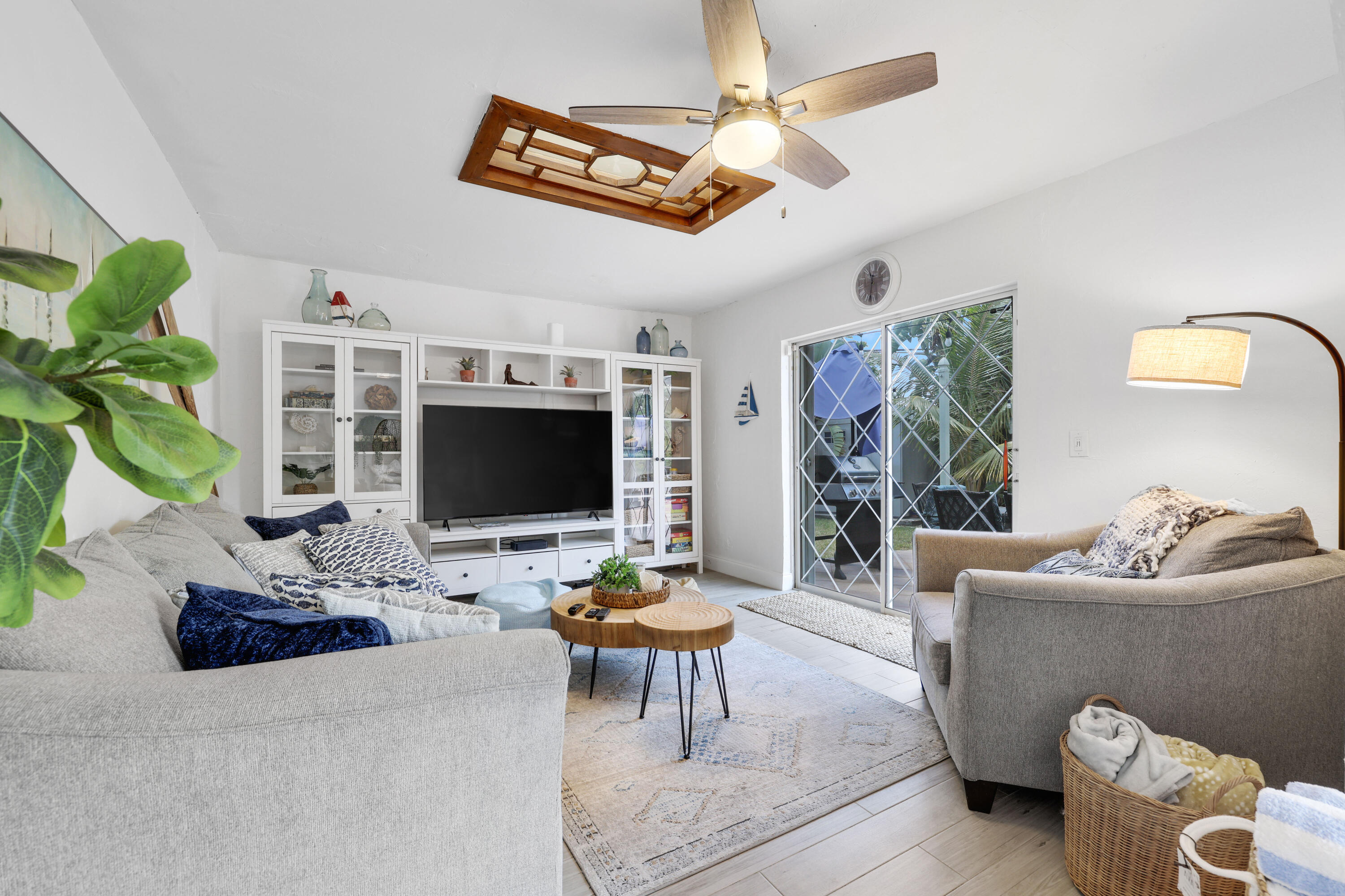 342 Southwest 14th Street Pompano Beach, FL 33060 - Photo 17 of 39 a living room with furniture and a flat screen tv