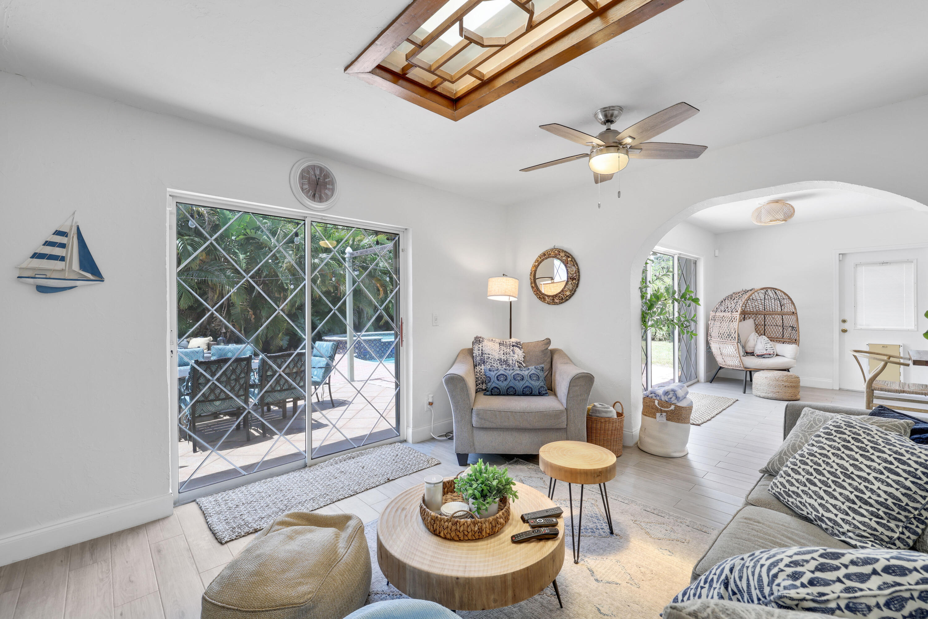 342 Southwest 14th Street Pompano Beach, FL 33060 - Photo 19 of 39 a living room with furniture a fireplace and a large window