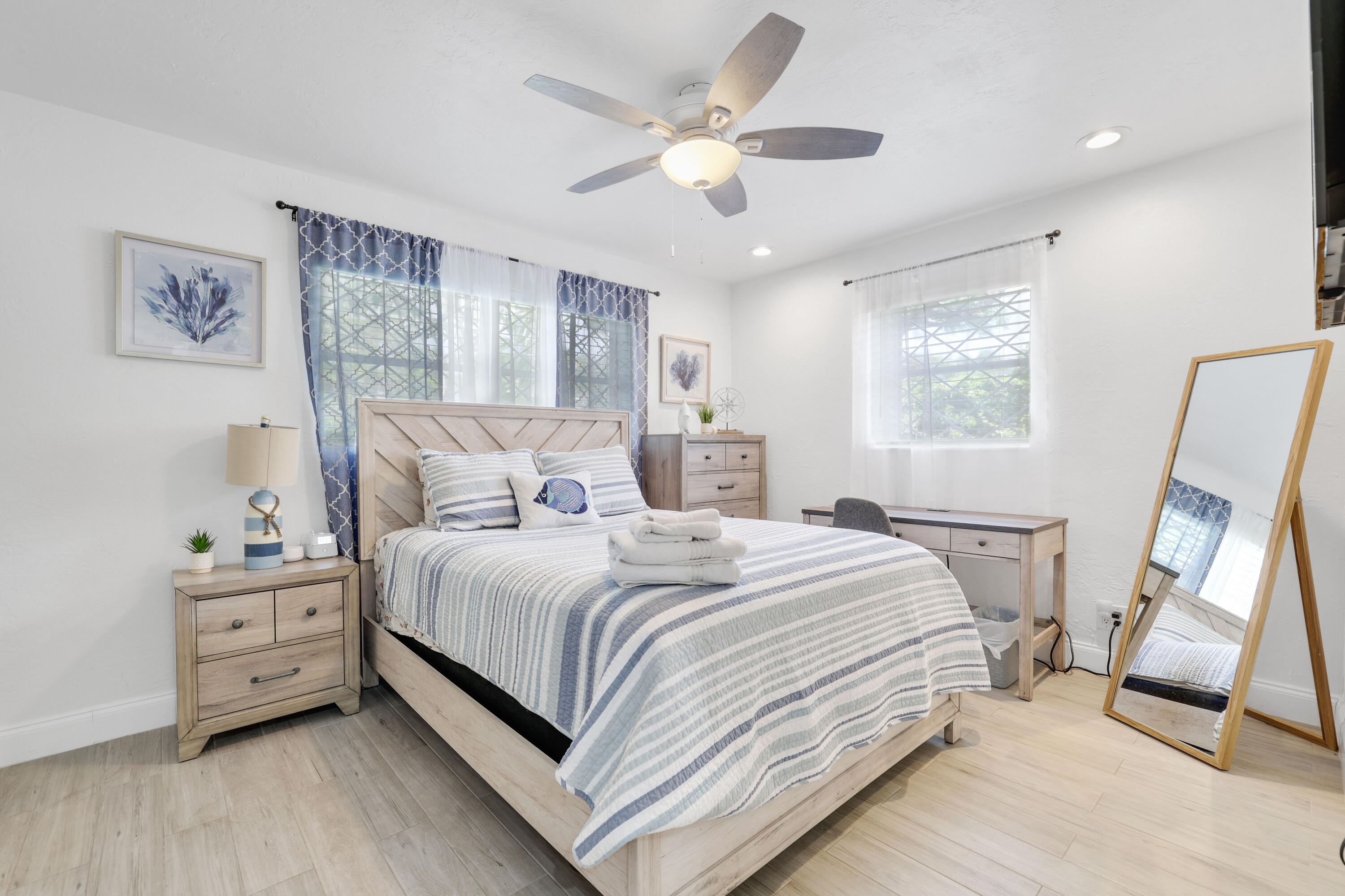342 Southwest 14th Street Pompano Beach, FL 33060 - Photo 28 of 39 a bedroom with a bed and a large mirror on the dresser