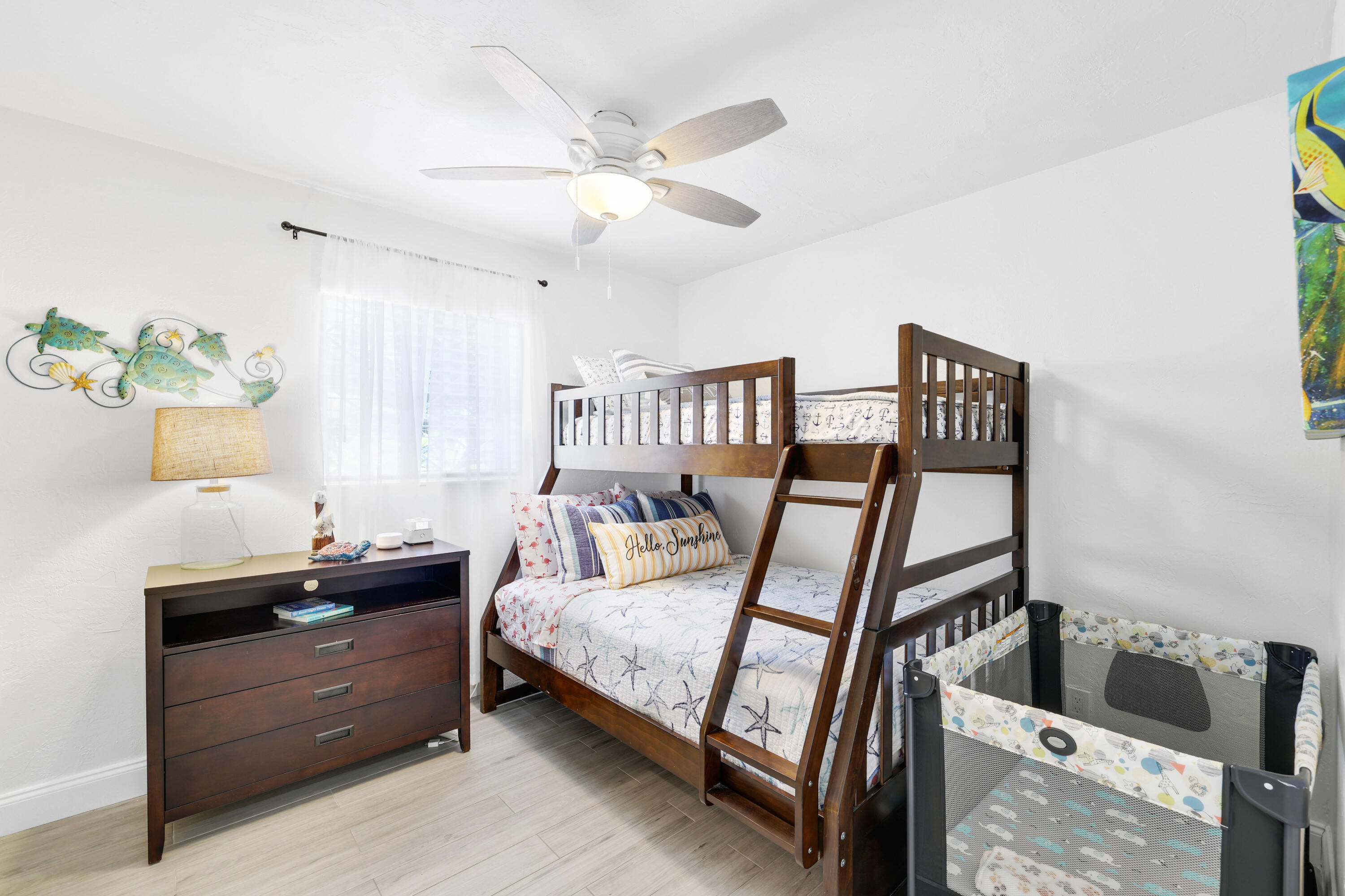 342 Southwest 14th Street Pompano Beach, FL 33060 - Photo 30 of 39 a bedroom with a bed and a chandelier