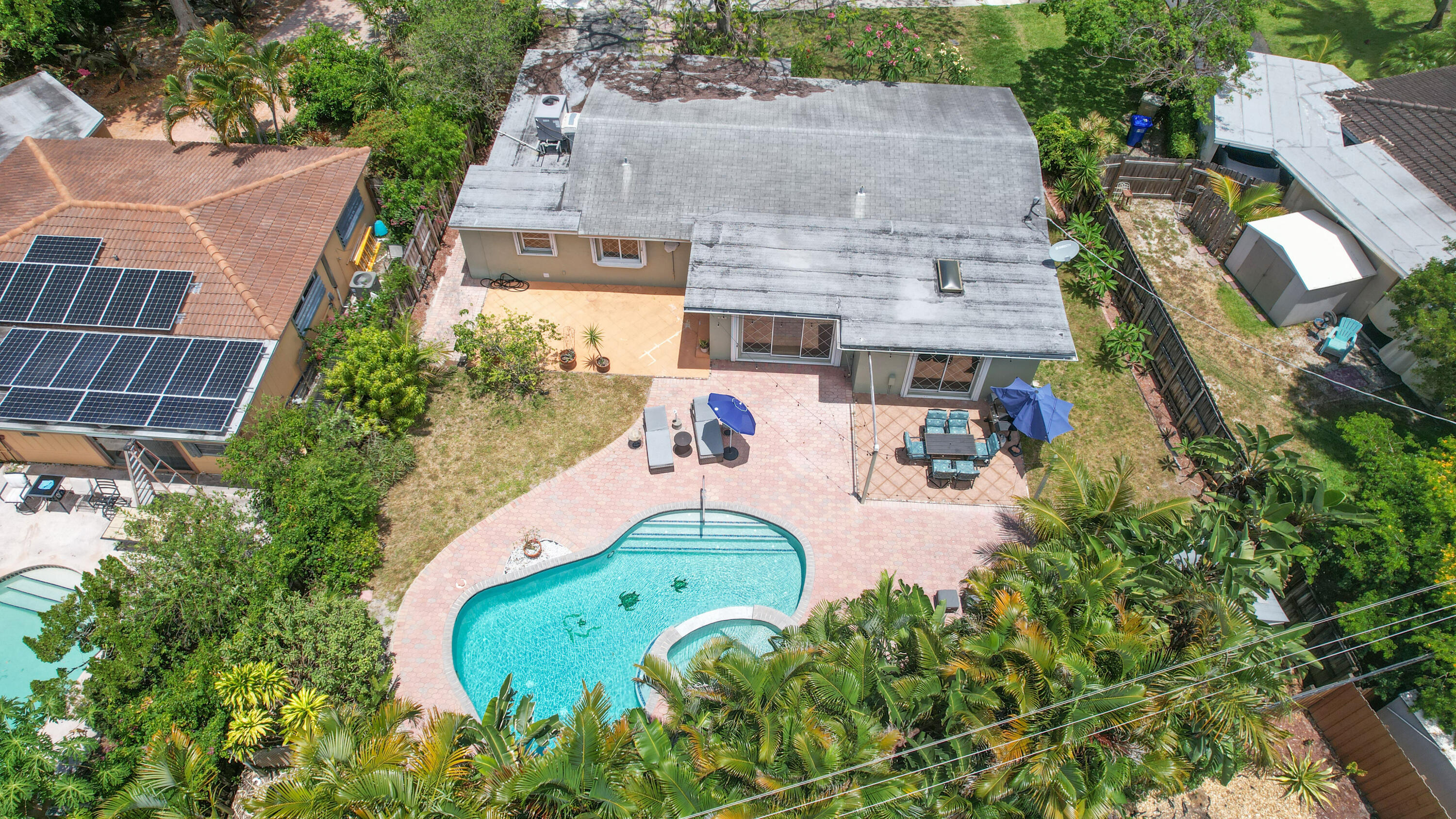 342 Southwest 14th Street Pompano Beach, FL 33060 - Photo 3 of 39 an aerial view of a house with a yard and potted plants