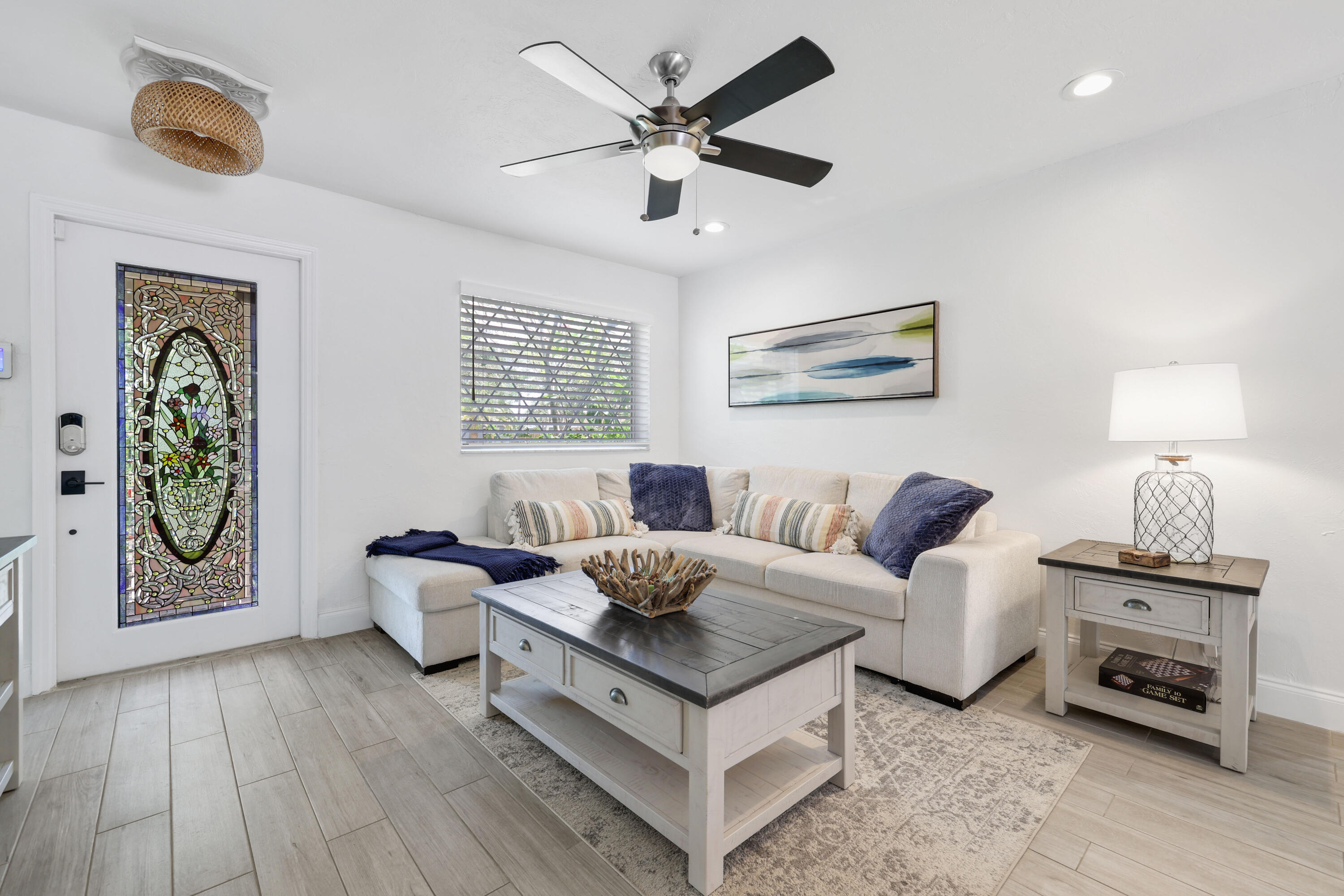 342 Southwest 14th Street Pompano Beach, FL 33060 - Photo 5 of 39 a living room with furniture and a window