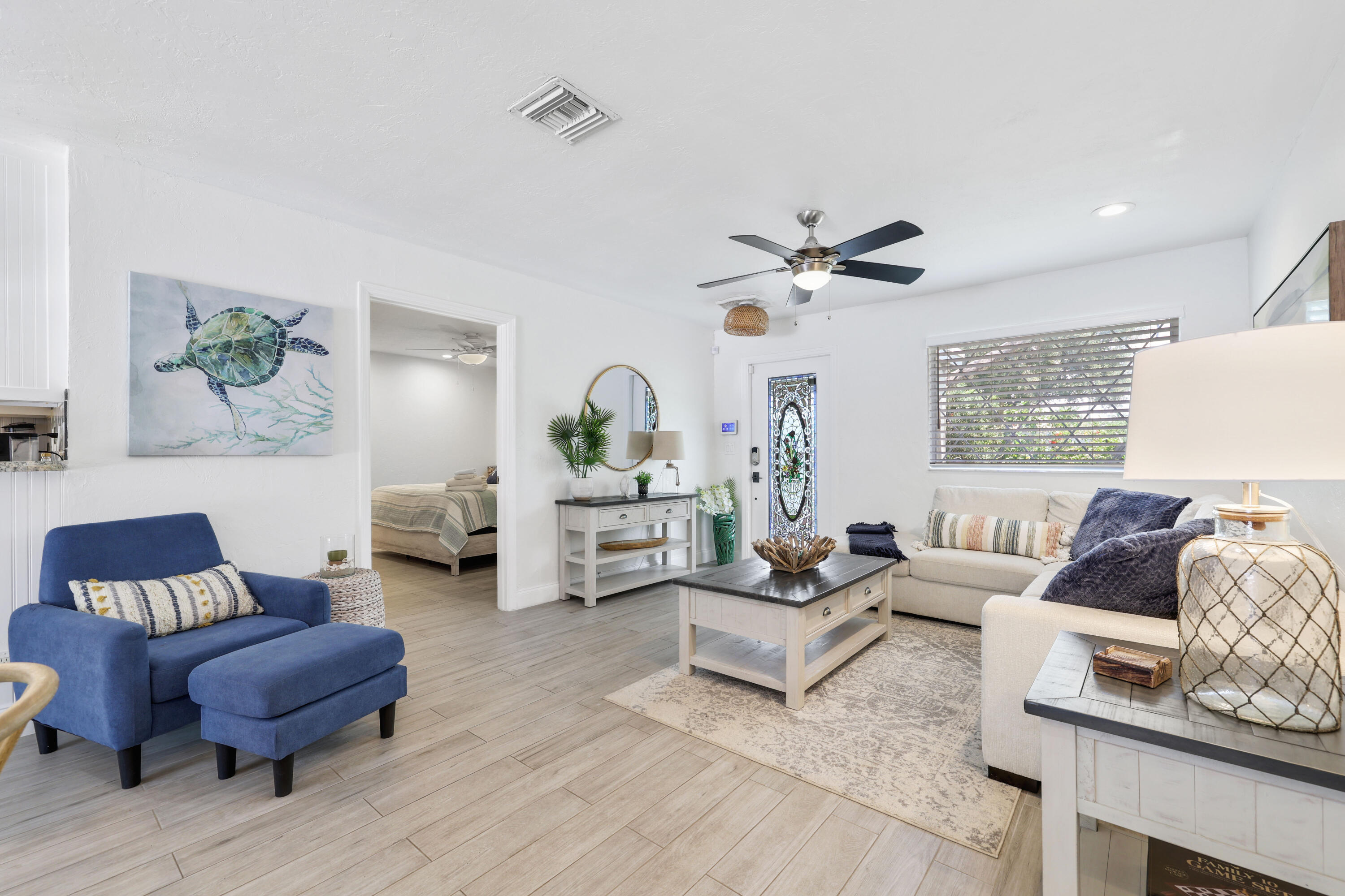342 Southwest 14th Street Pompano Beach, FL 33060 - Photo 6 of 39 a living room with furniture and a ceiling fan