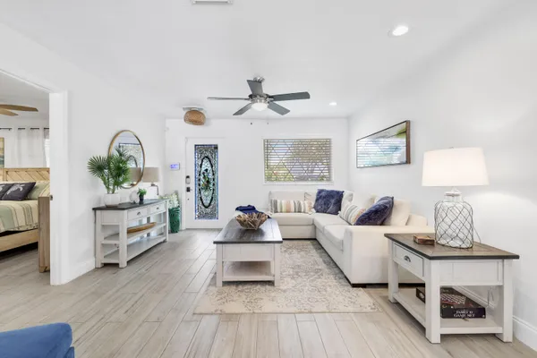 a living room with furniture and a lamp