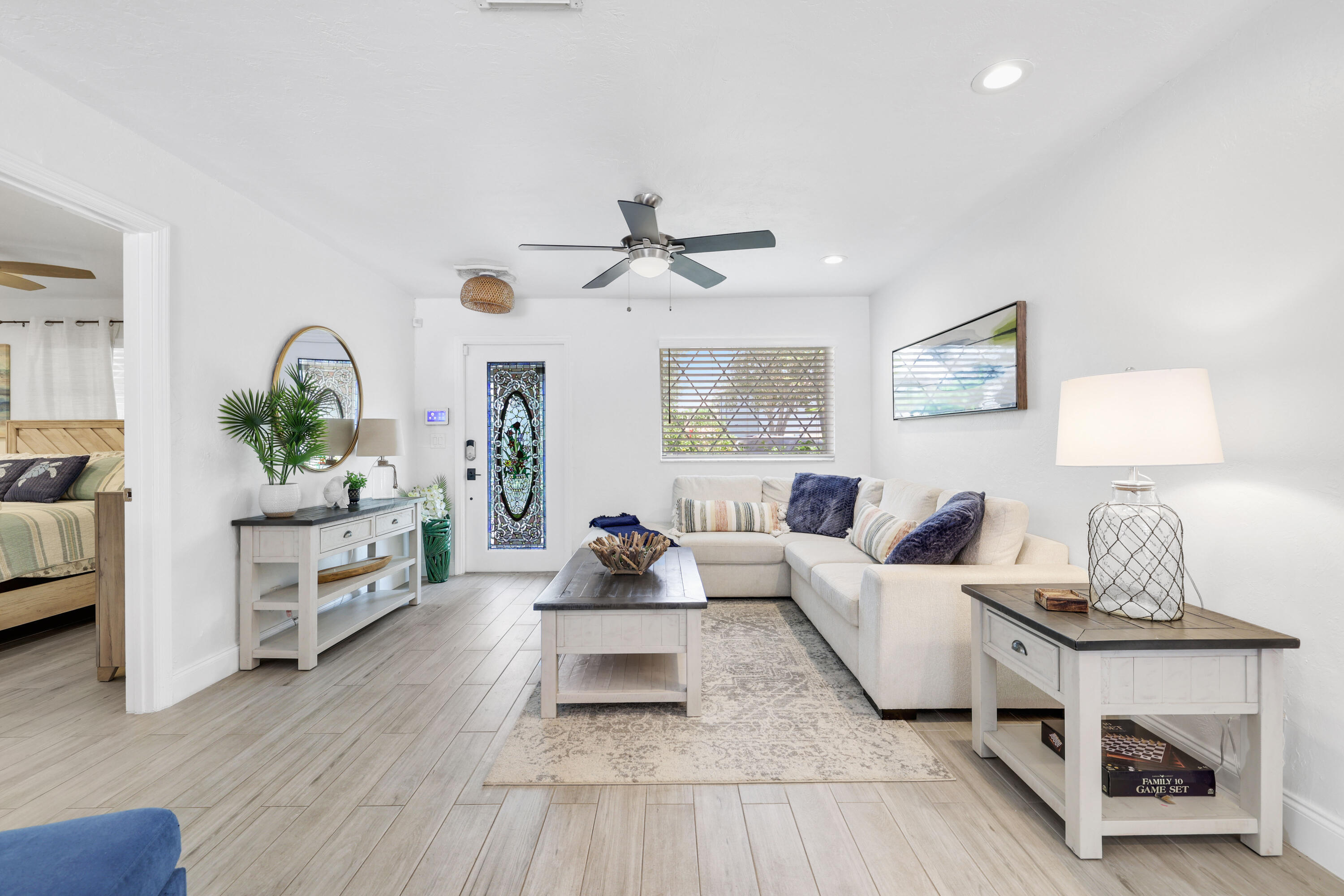 342 Southwest 14th Street Pompano Beach, FL 33060 - Photo 7 of 39 a living room with furniture and a lamp
